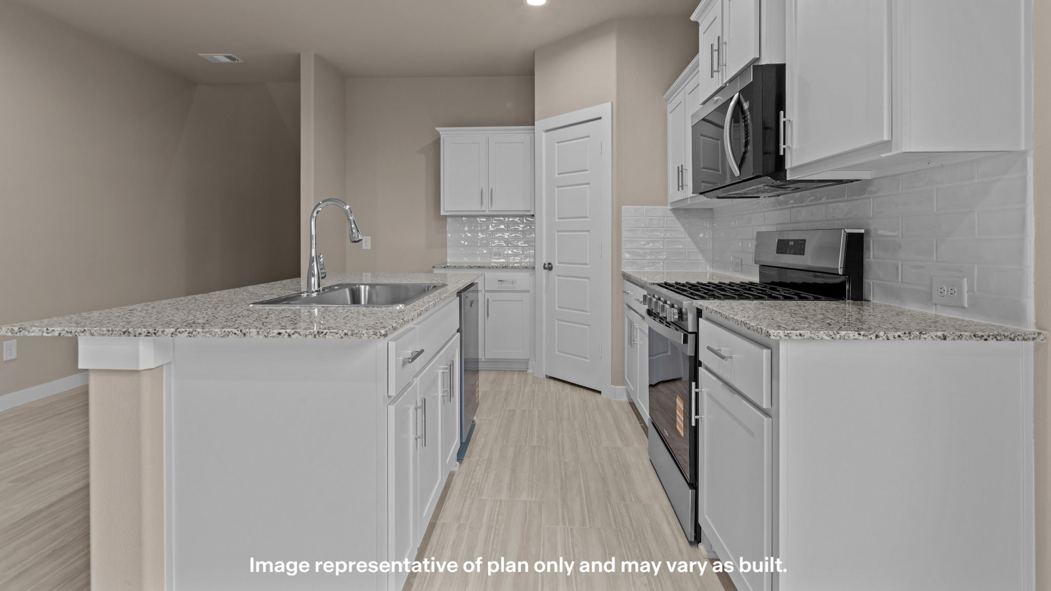 Kitchen with stainless steel appliances, shaker style cabinets, and elevated finishes