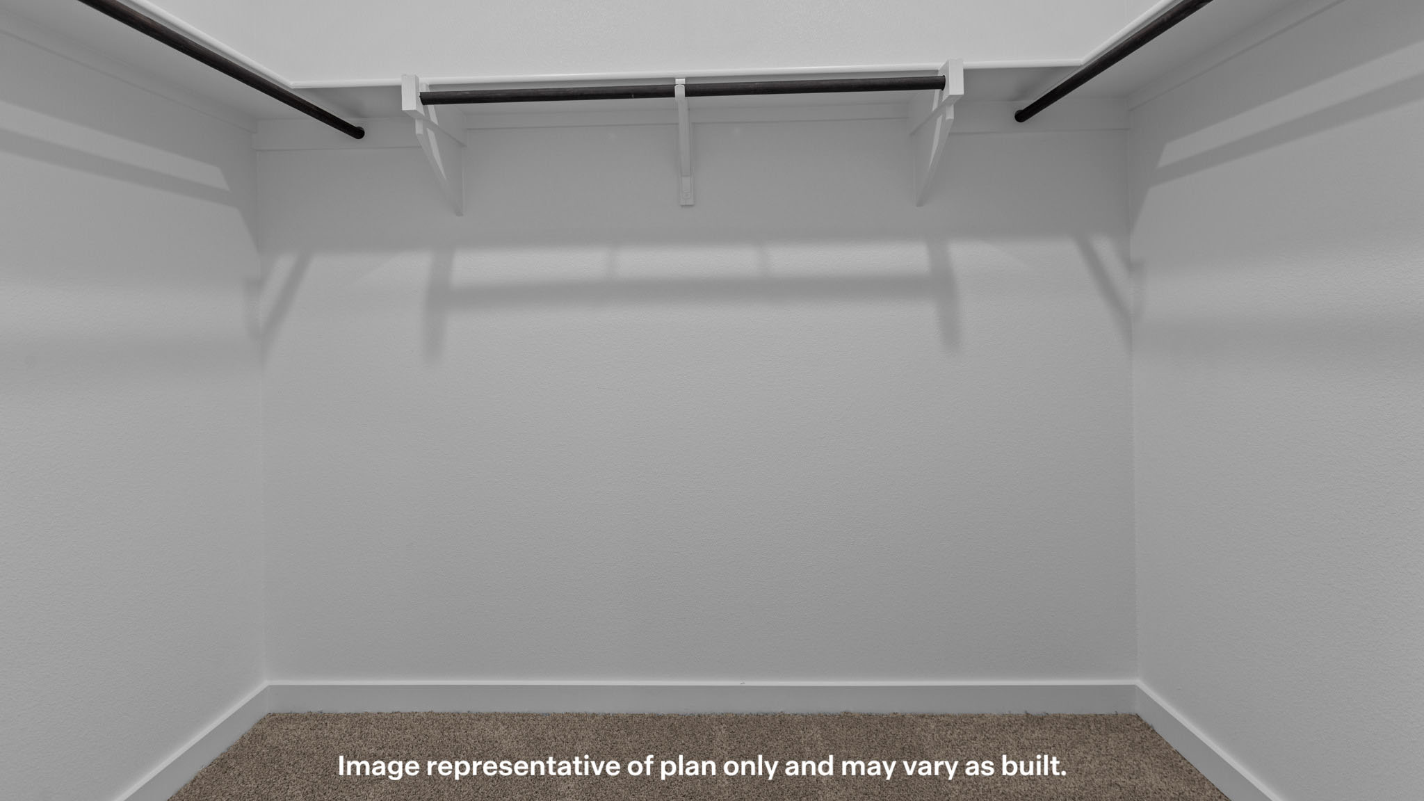 Private primary walk-in closet with extra storage space