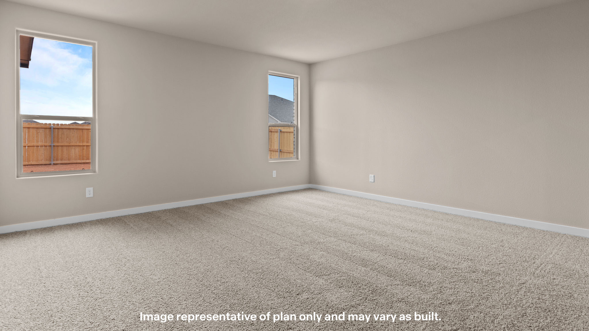 Primary bedroom with plush carpet floors and double light allowing windows