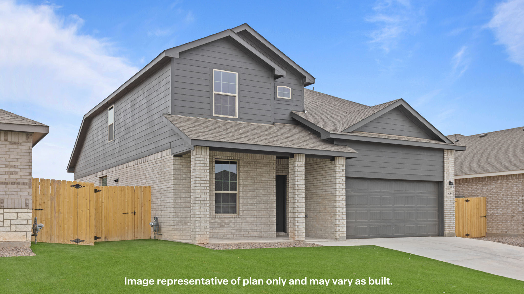 Side view of two story timeless brick home