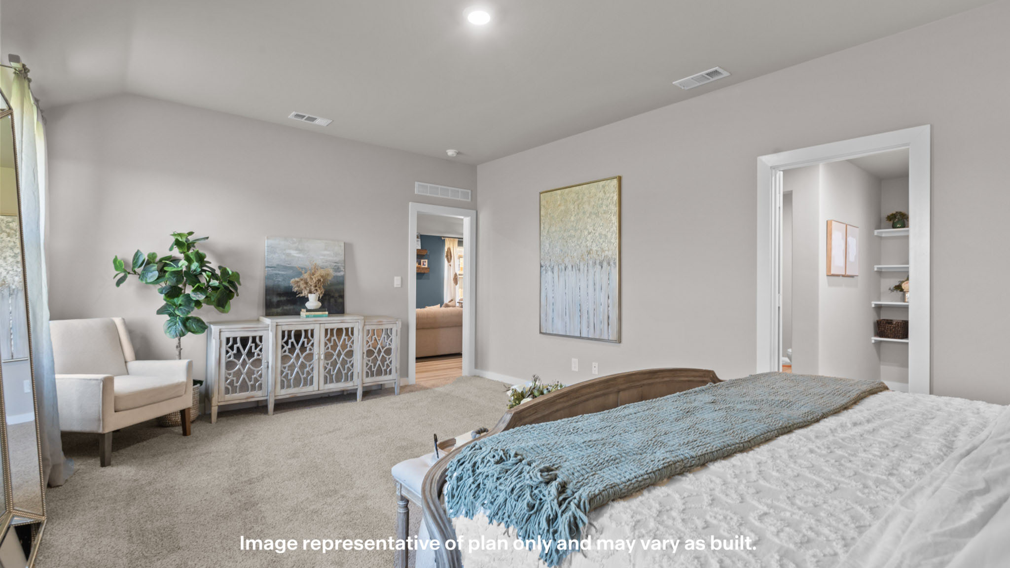 Primary bedroom with private attached bathroom and walk-in closet