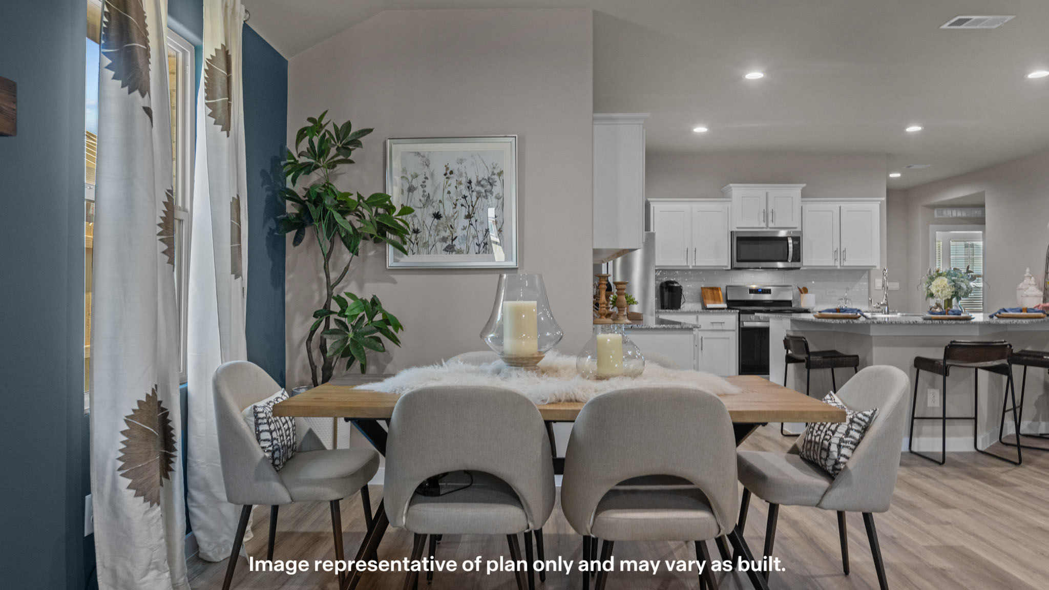 Open dining room sOpen concept kitchen, living, family, and dining room spacepace adjacent to kitchen