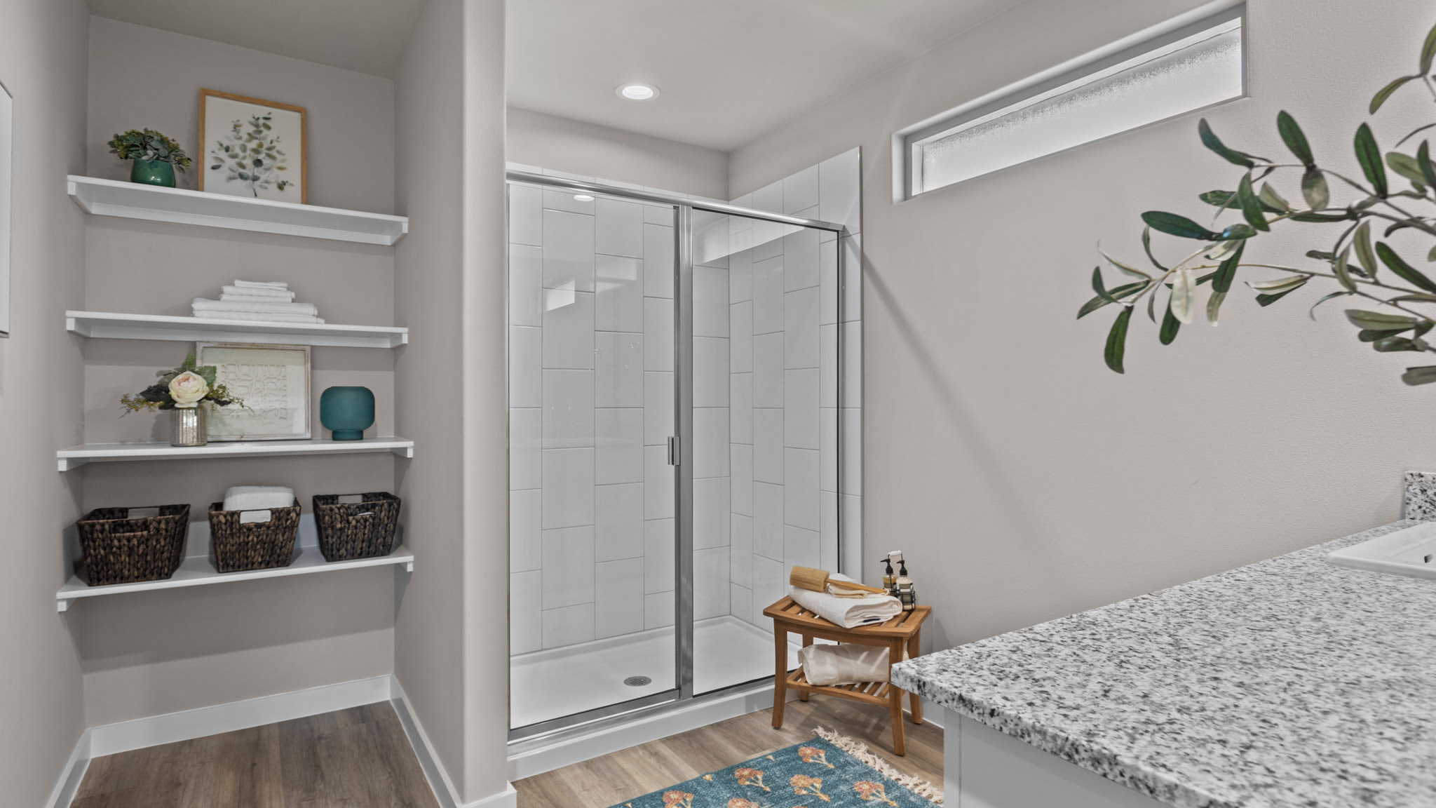 Primary bathroom with luxurious shower and built in storage