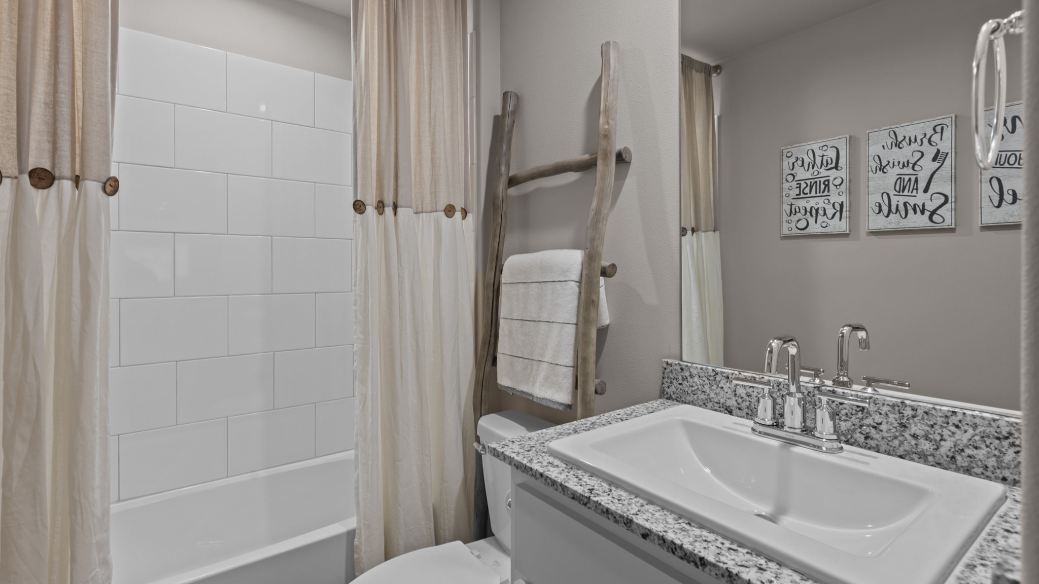 Guest bathroom with built in vanity and combination bathtub shower