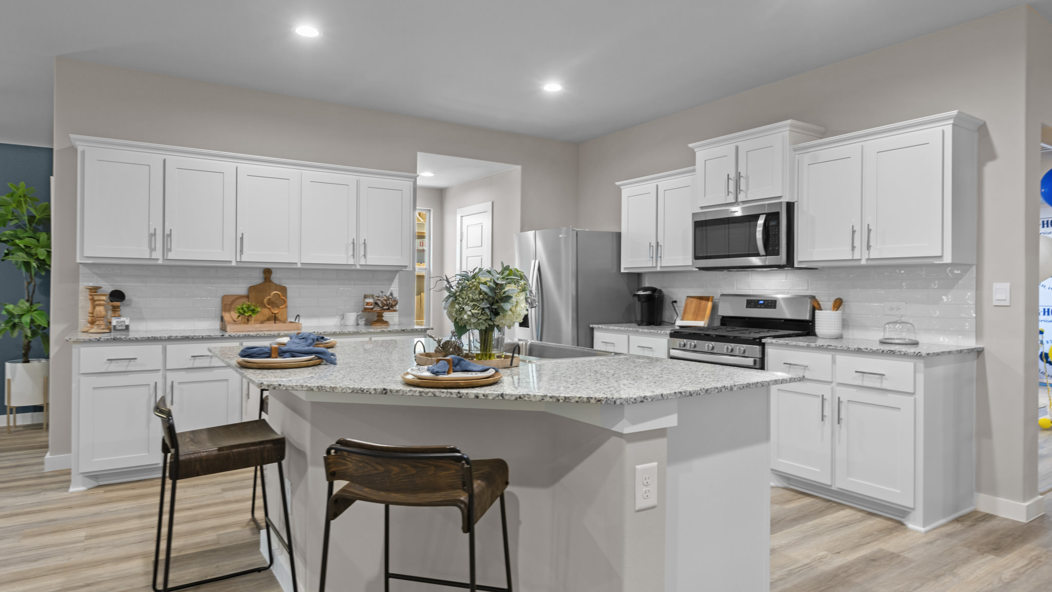 Spacious open concept kitchen with island and counter prep space