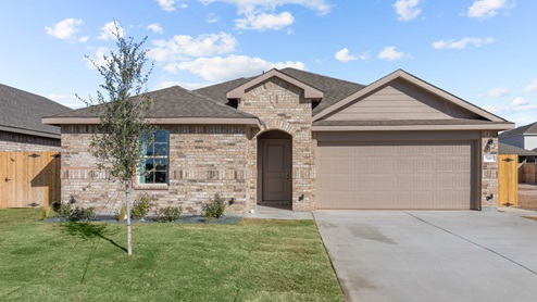Exterior of single-story family home with timeless light brick exterior