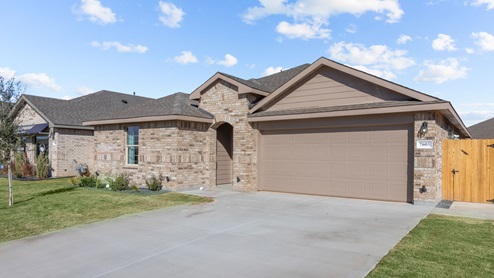 Single-story classic brick style home with front garage