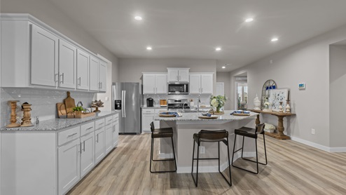 Open concept kitchen and dining area with kitchen island