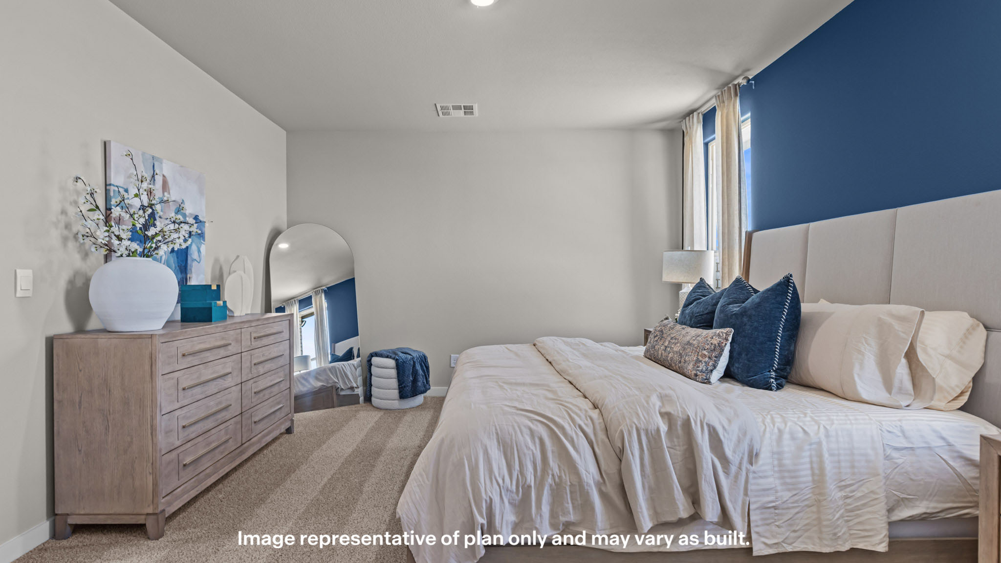 Primary bedroom with plush carpet floors and light allowing double windows