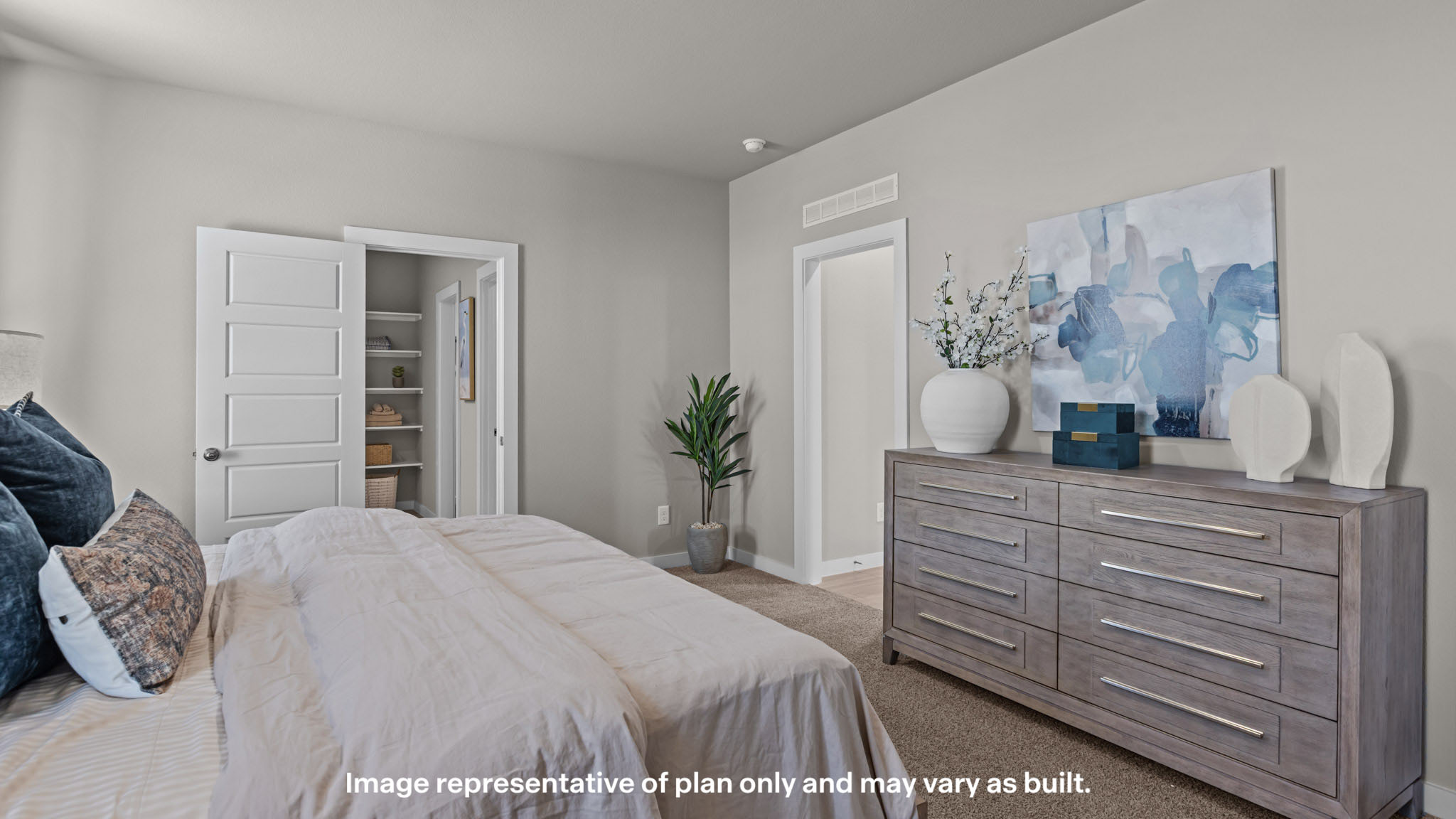 Primary bedroom with private attached bathroom and walk-in closet