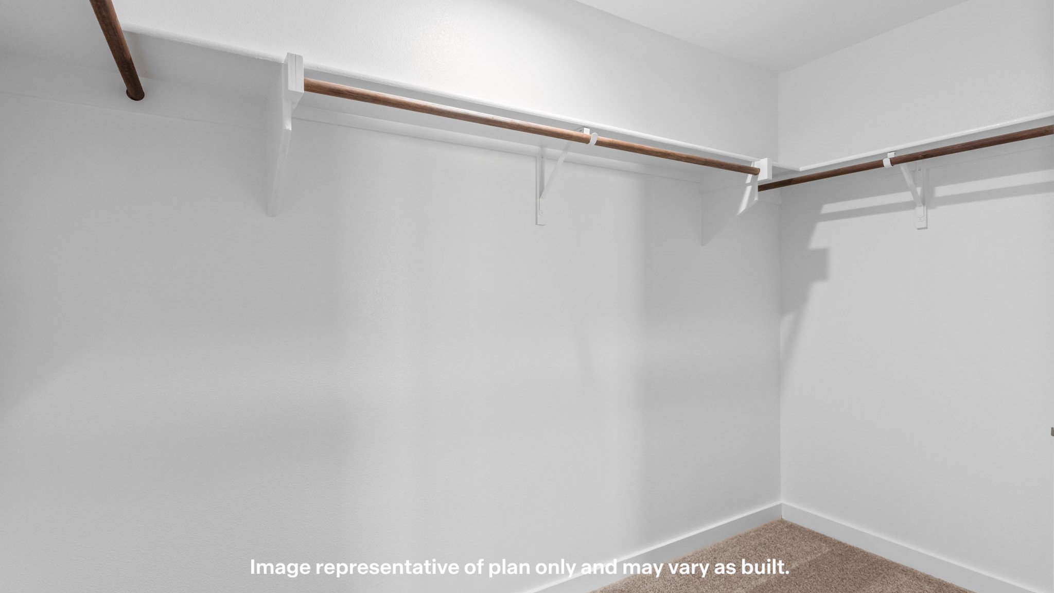 Primary walk-in closet with built in storage space