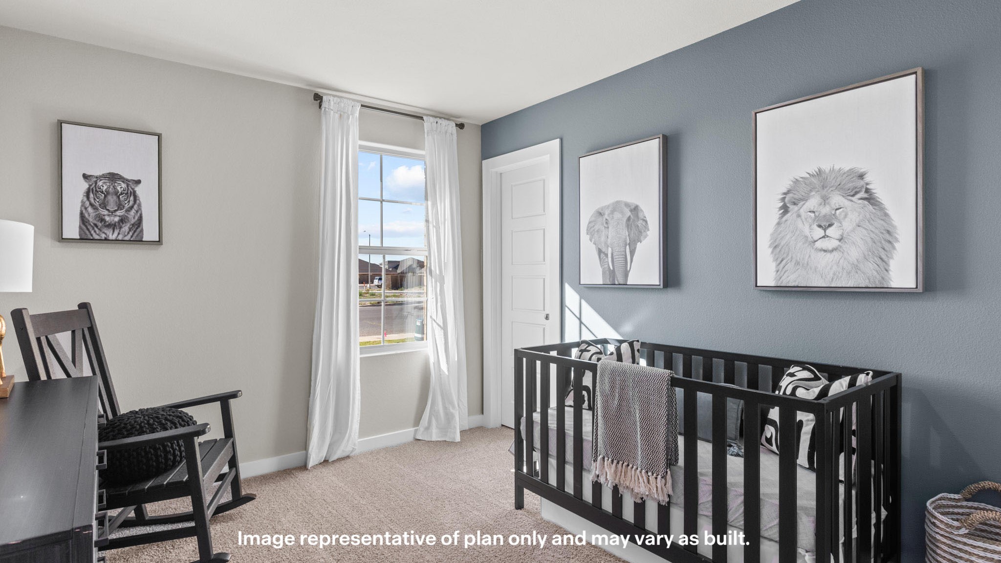 Guest bedroom designed and decorated as a blue nursery