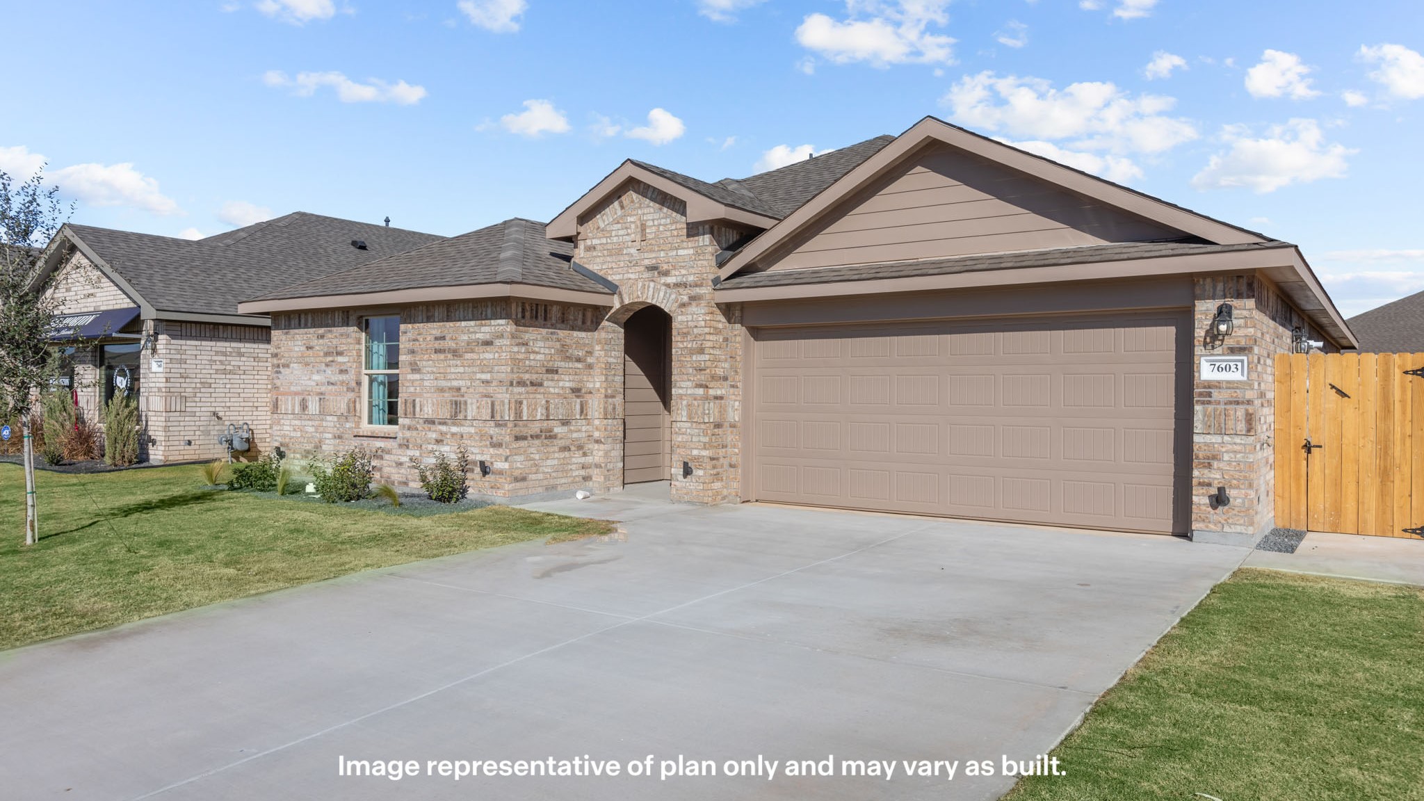 Single-story classic brick style home with front garage