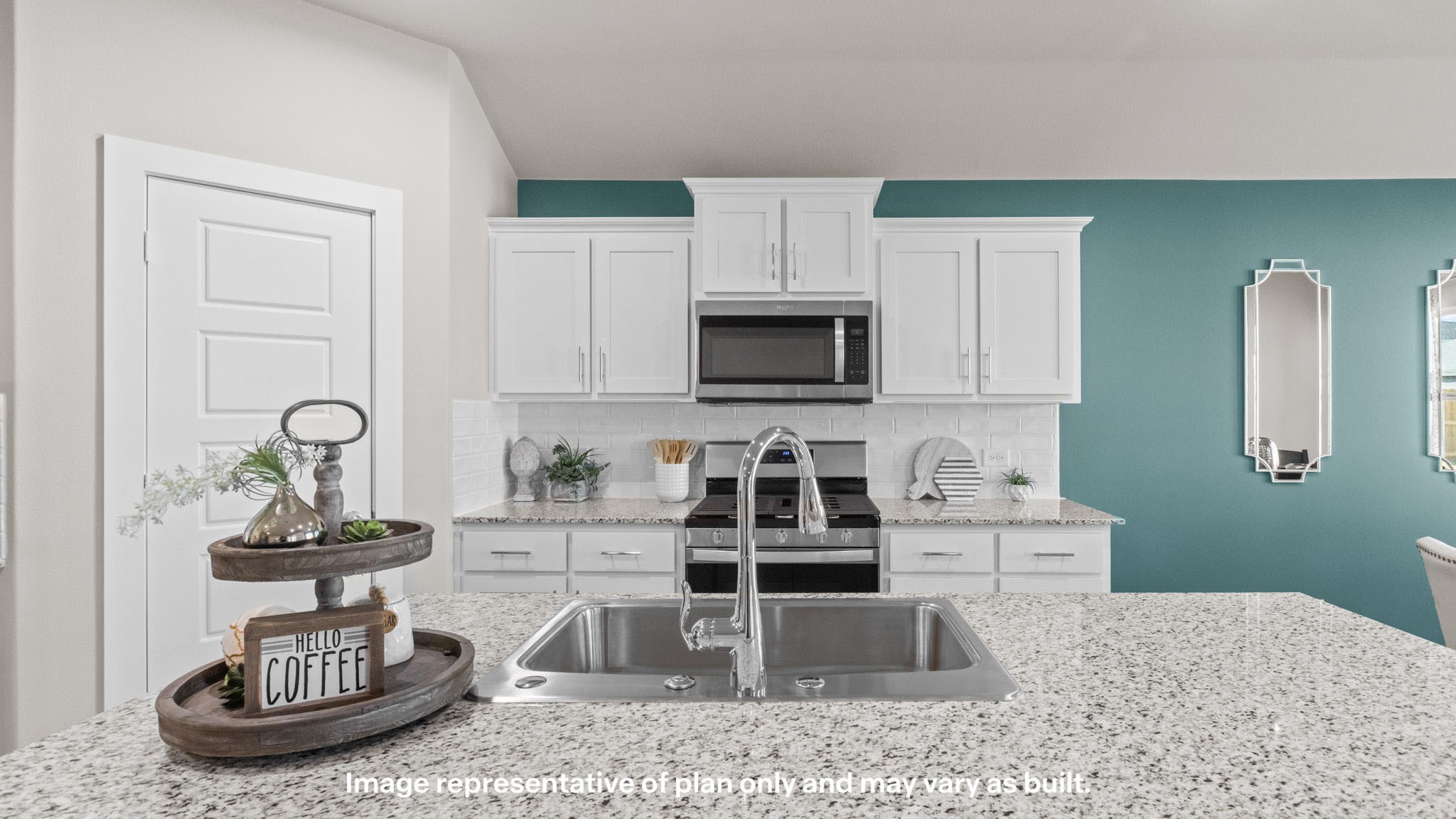 Open concept kitchen with spacious island, modern tile backsplash, and shaker style cabinets