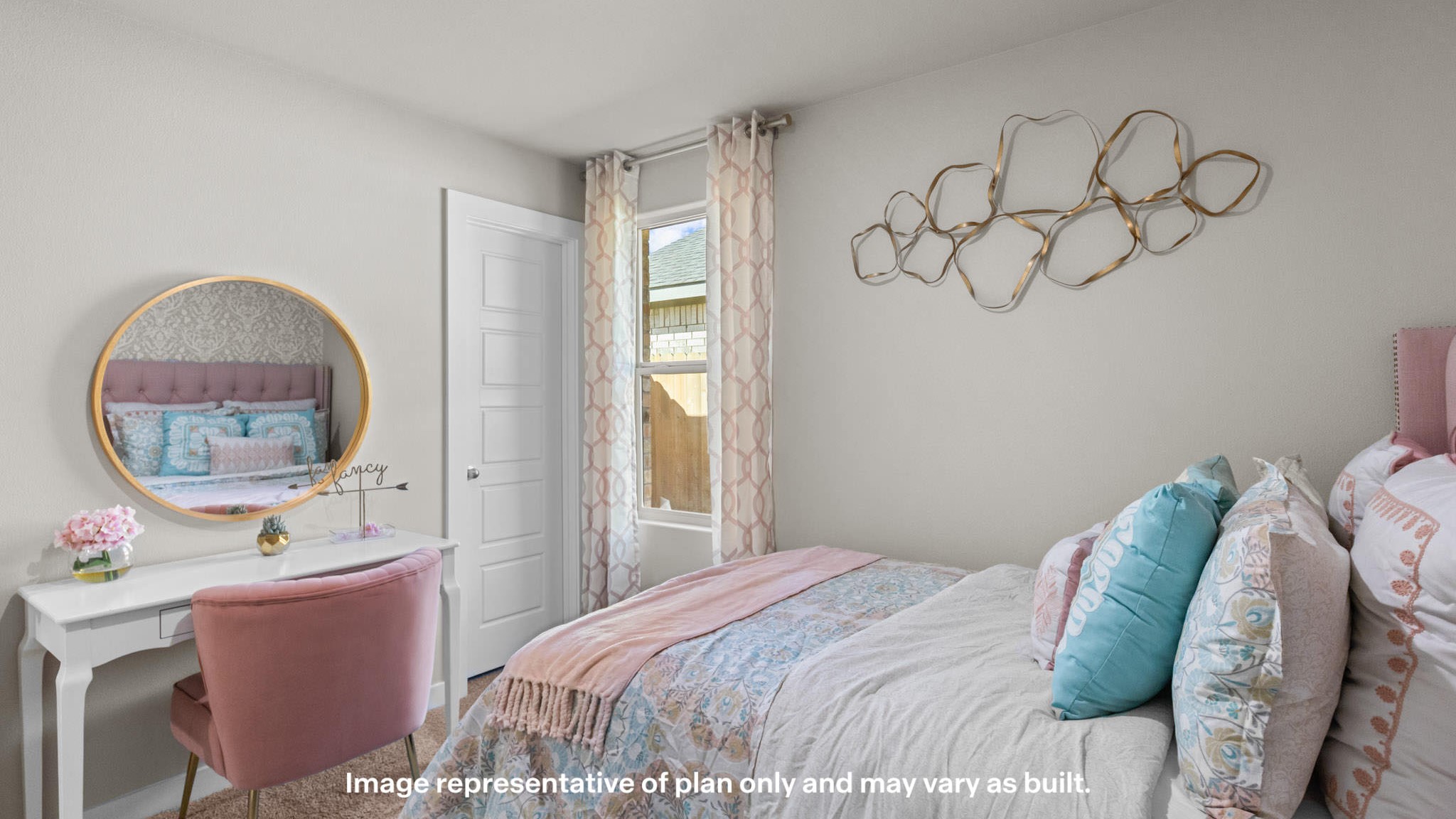Pink girl's bedroom with bright accents and gold details