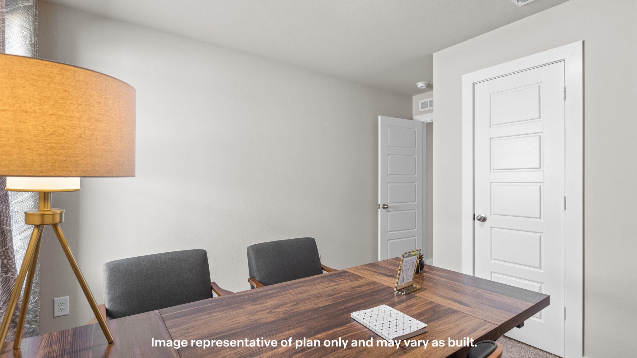 Office space in guest bedroom with room for spacious desk and additional seating for guests