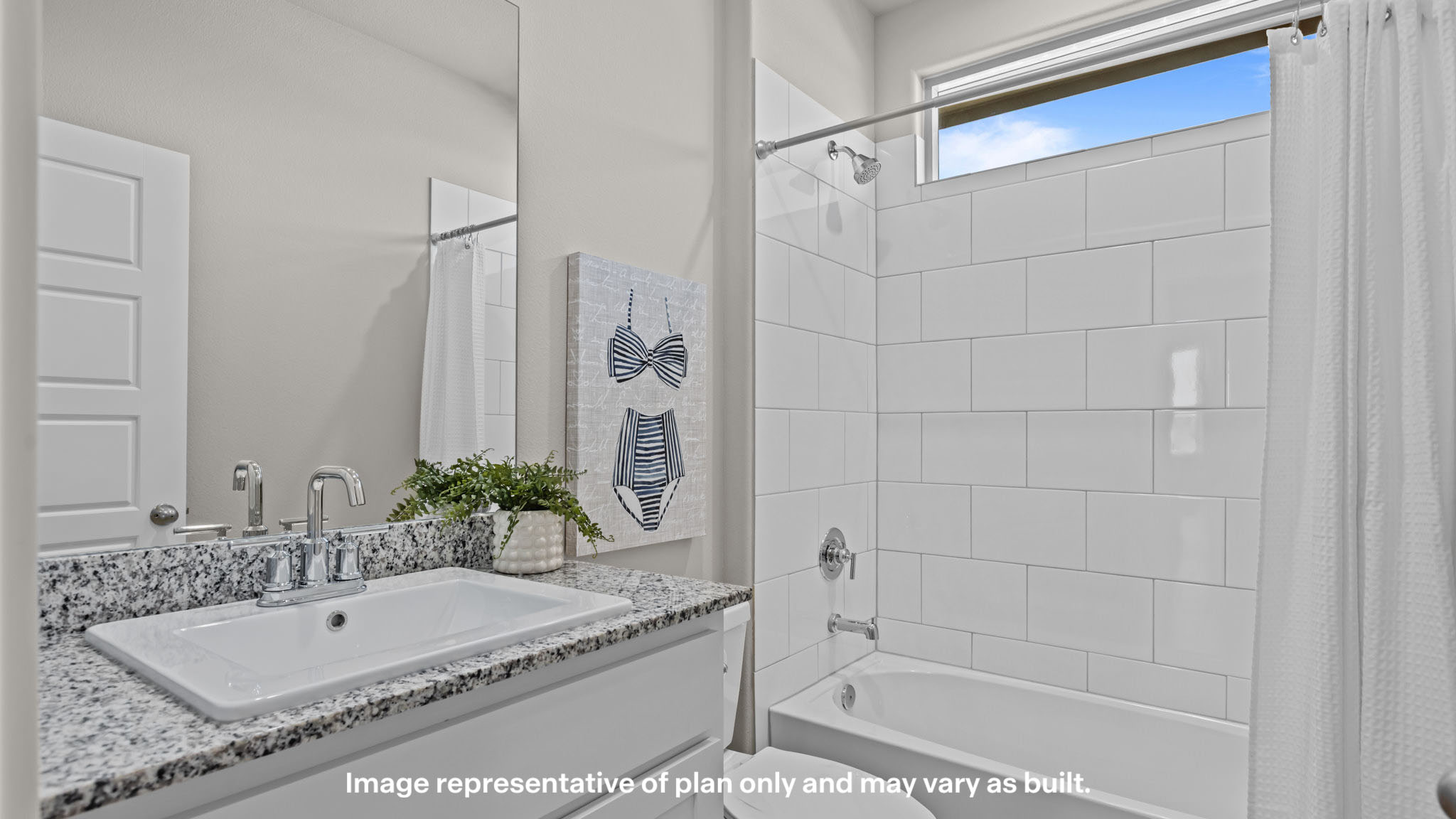 Guest bathroom with built in vanity and combination bathtub shower