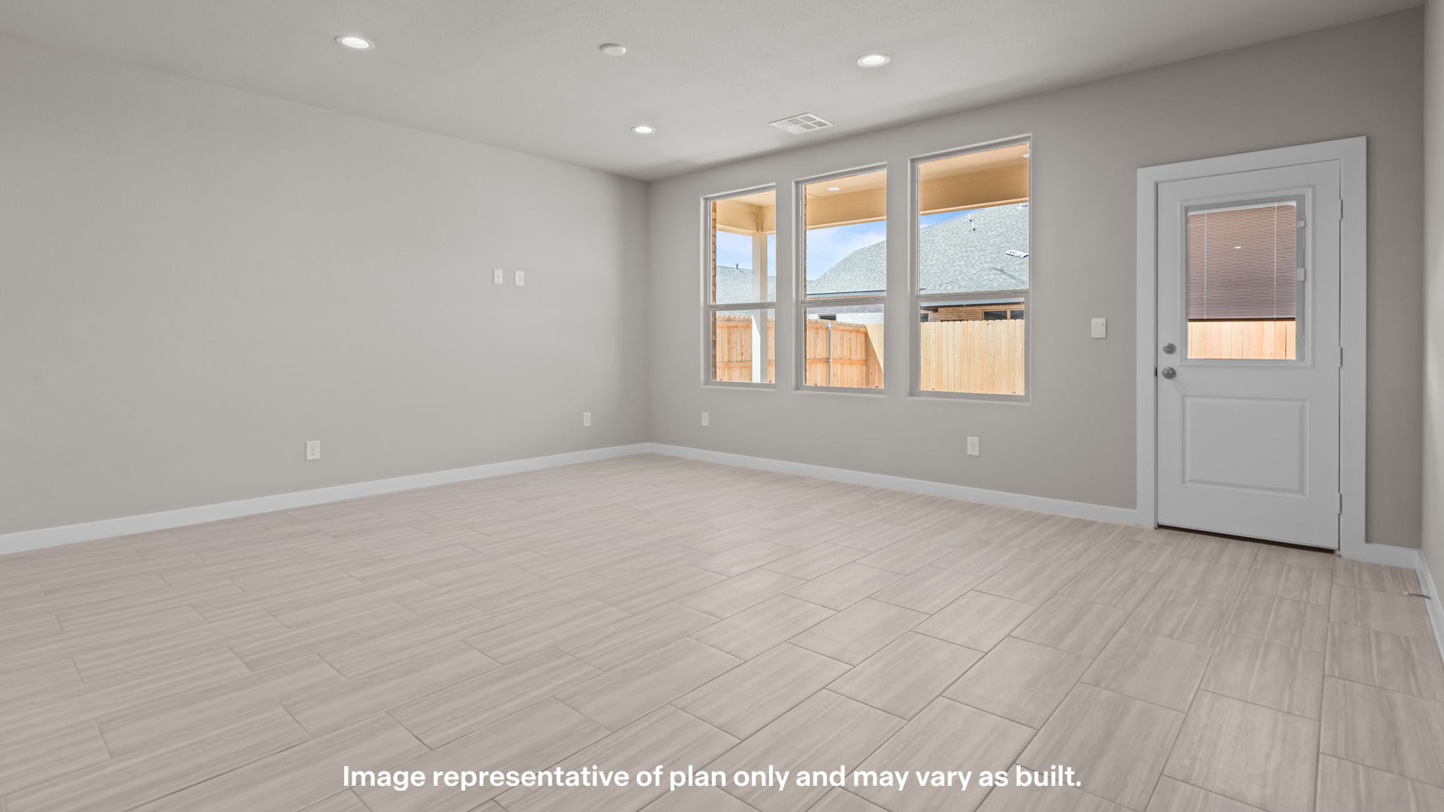 Spacious living and family room space with light allowing windows
