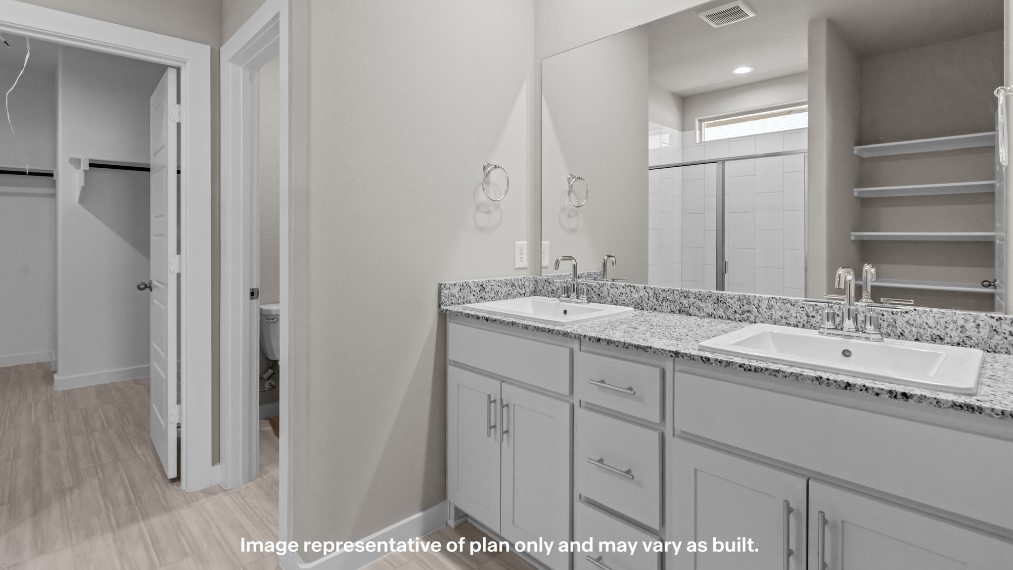 Private attached primary bathroom with built in vanity