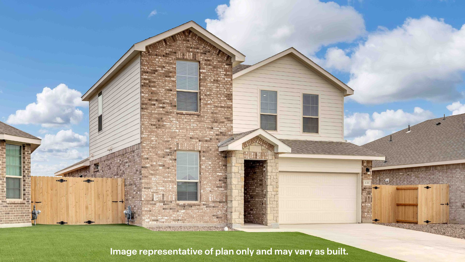 Side view of two story classic brick home