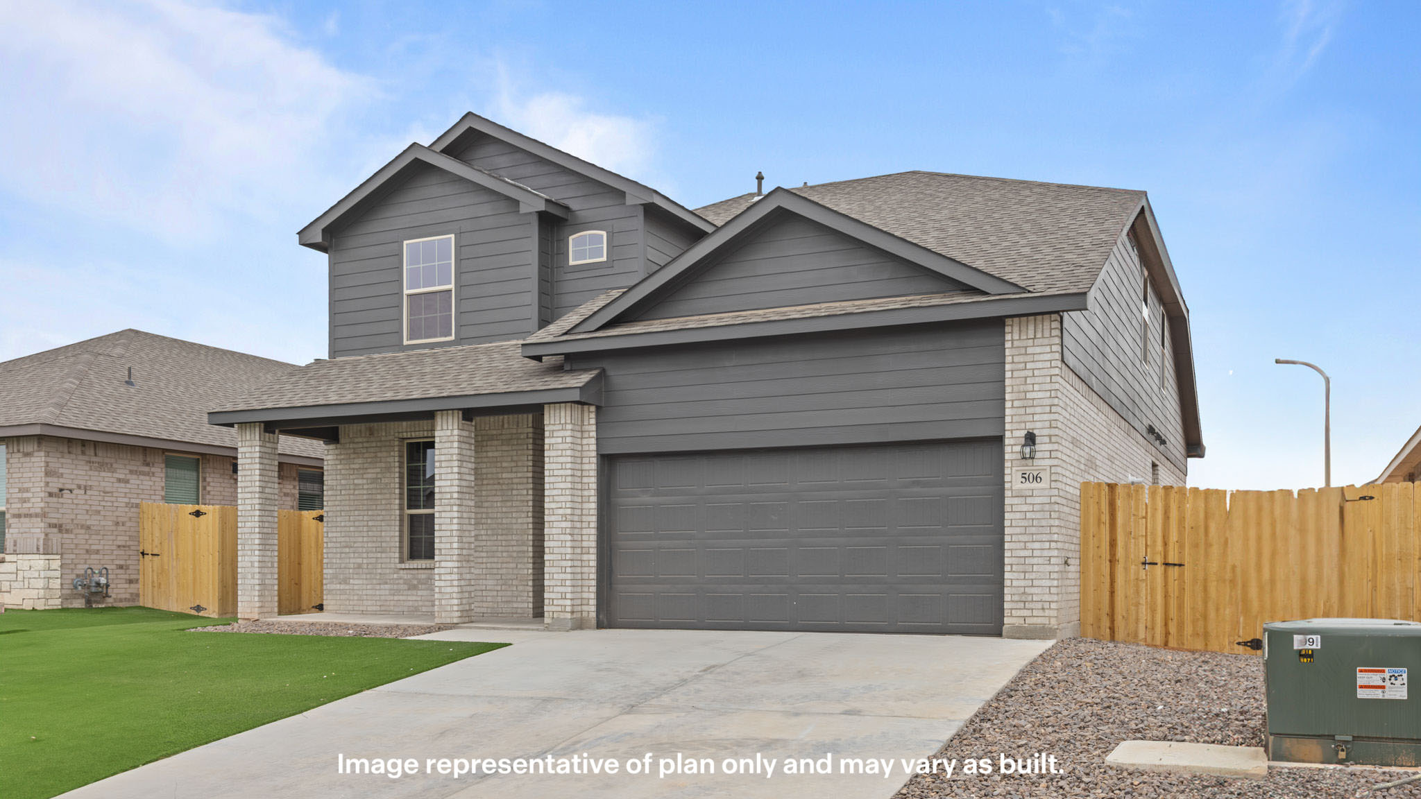 Side view of two story classic brick home