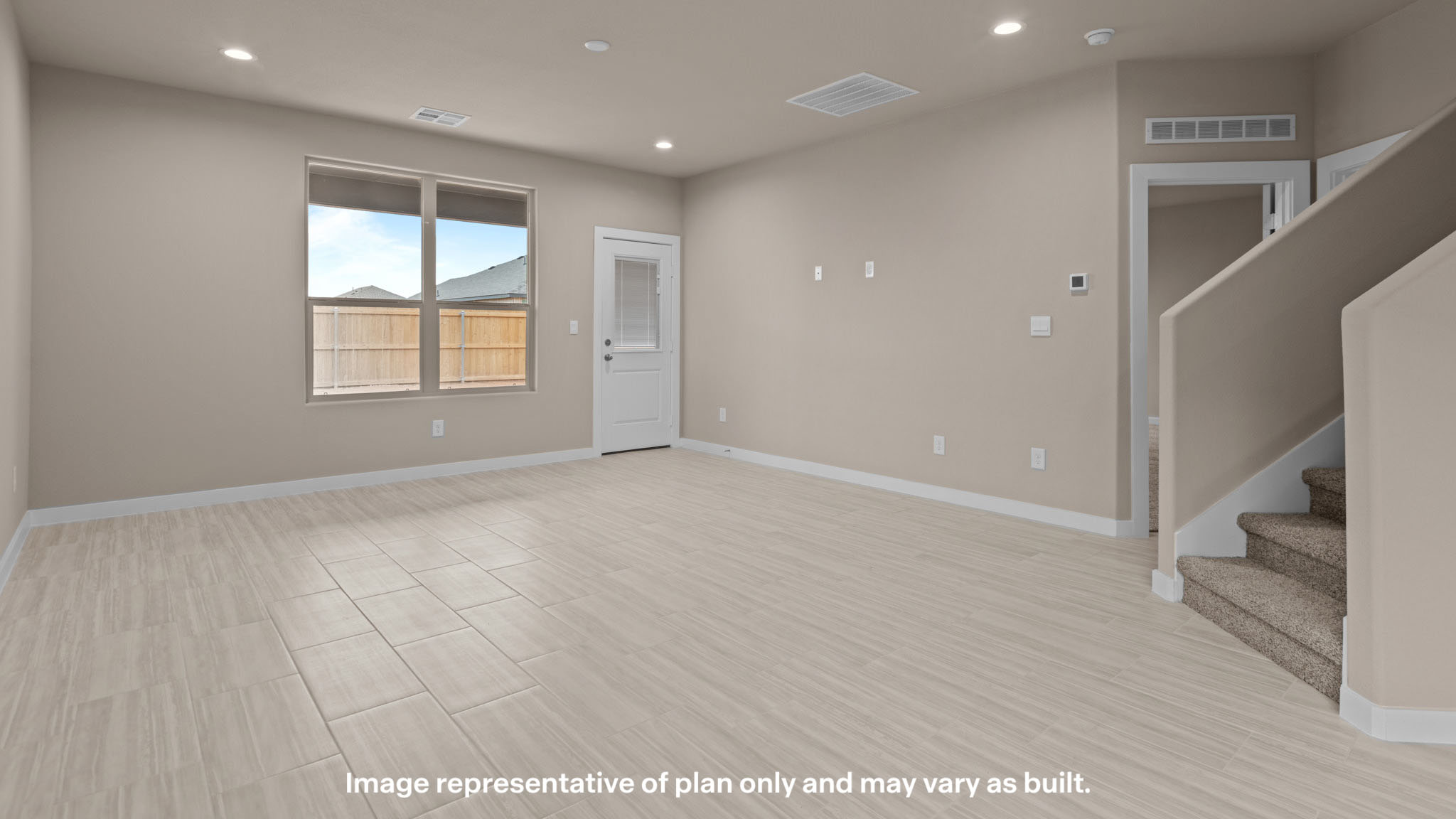 Spacious living and family room space with light allowing windows