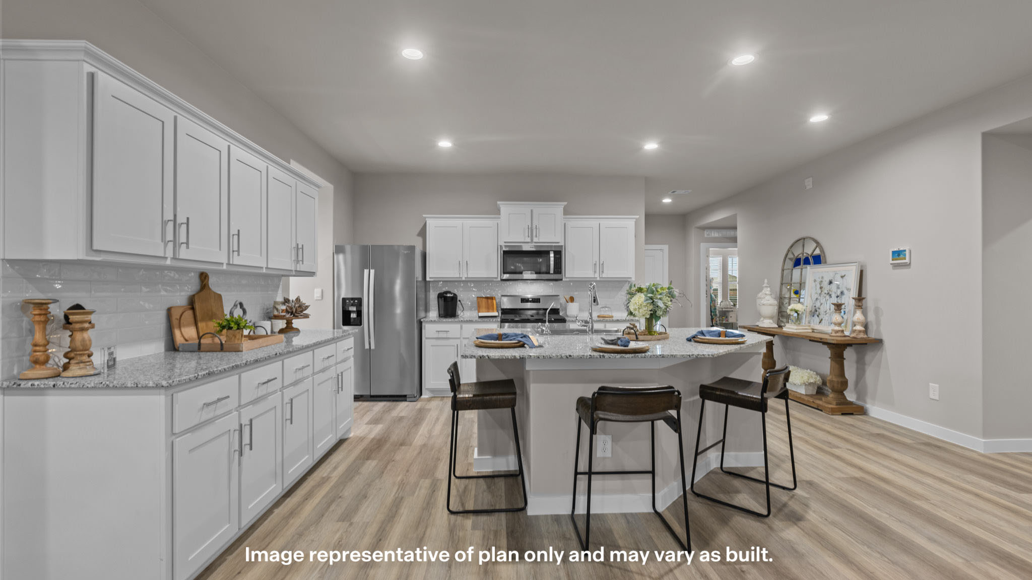 Spacious open concept kitchen with island and counter prep space