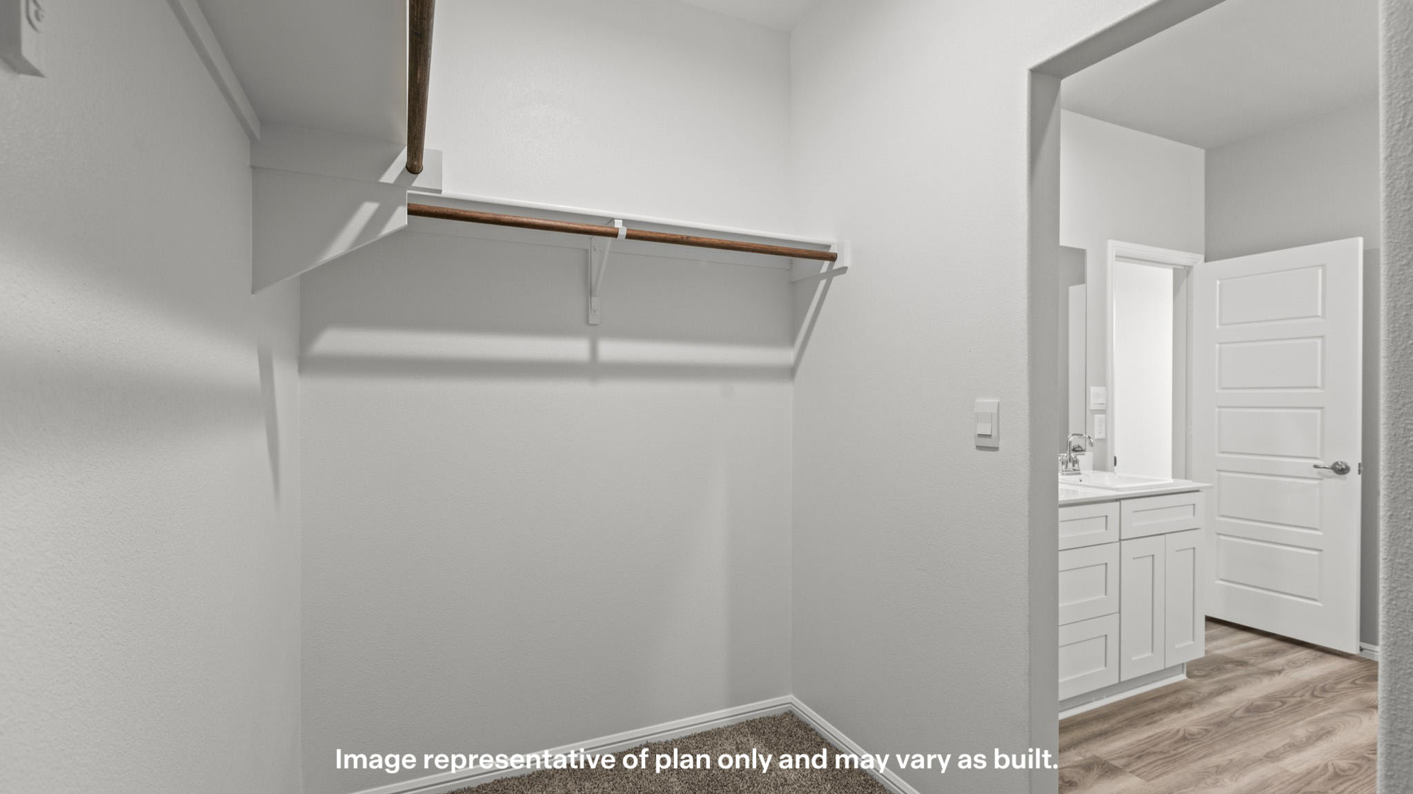 Primary walk-in closet with extra storage space