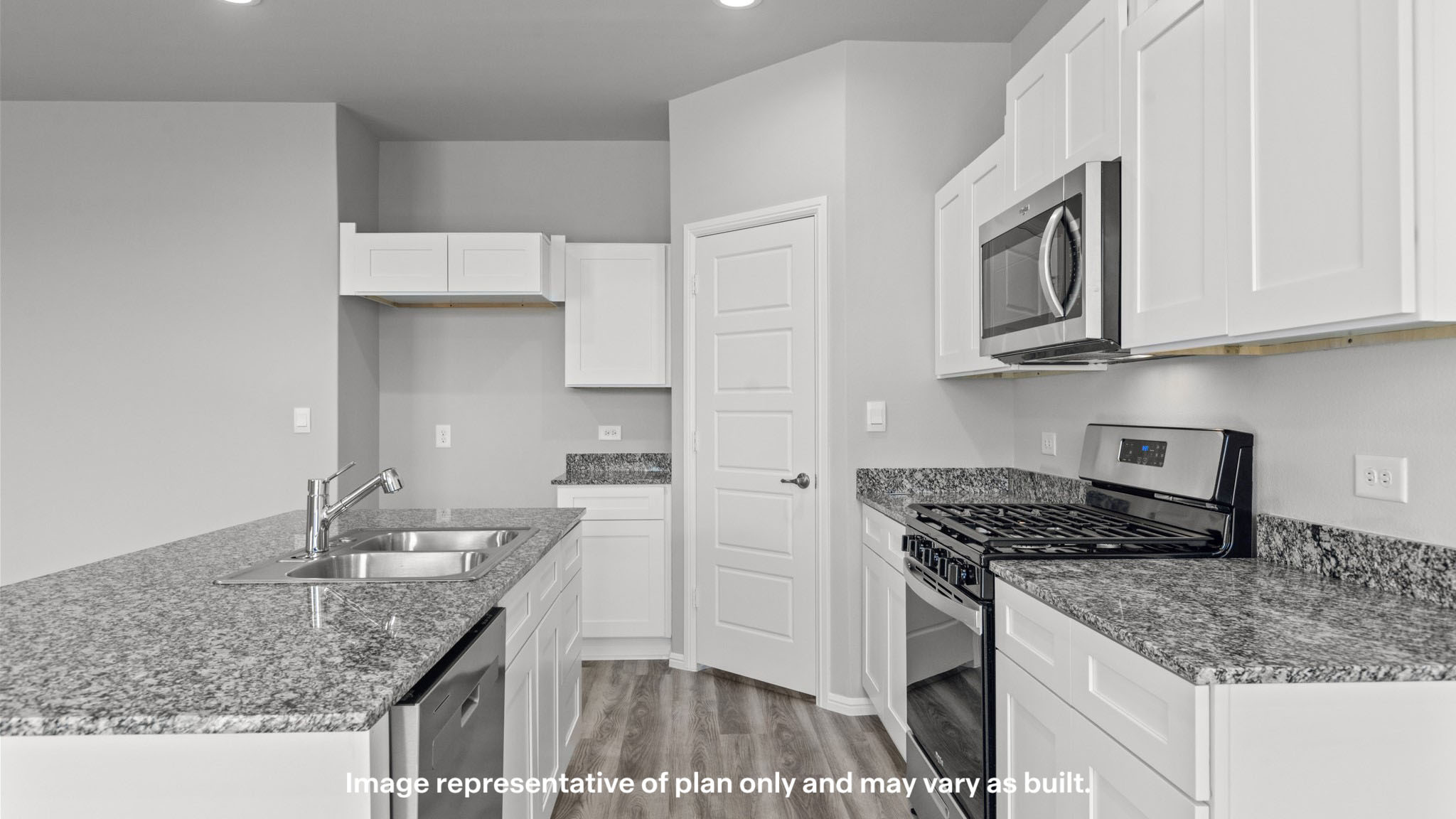 Open concept kitchen with stainless steel appliances, shaker style cabinets, and elevated finishes