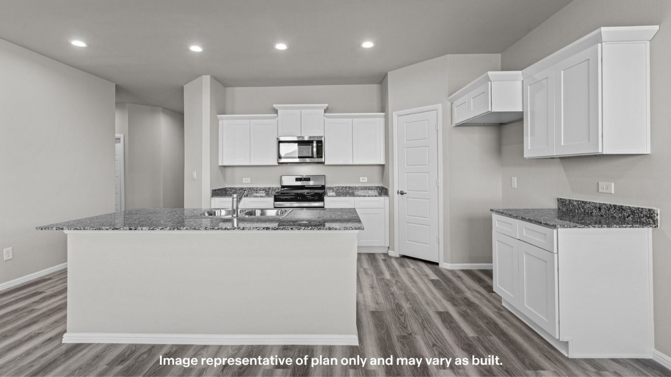 Open kitchen layout with large island and ample prep space.