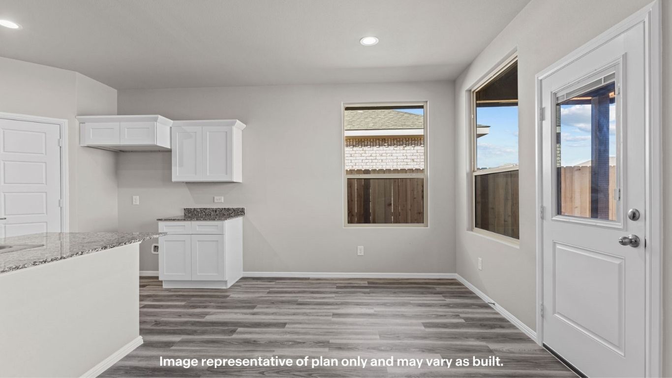 Spacious kitchen with island overlooking the main living area.