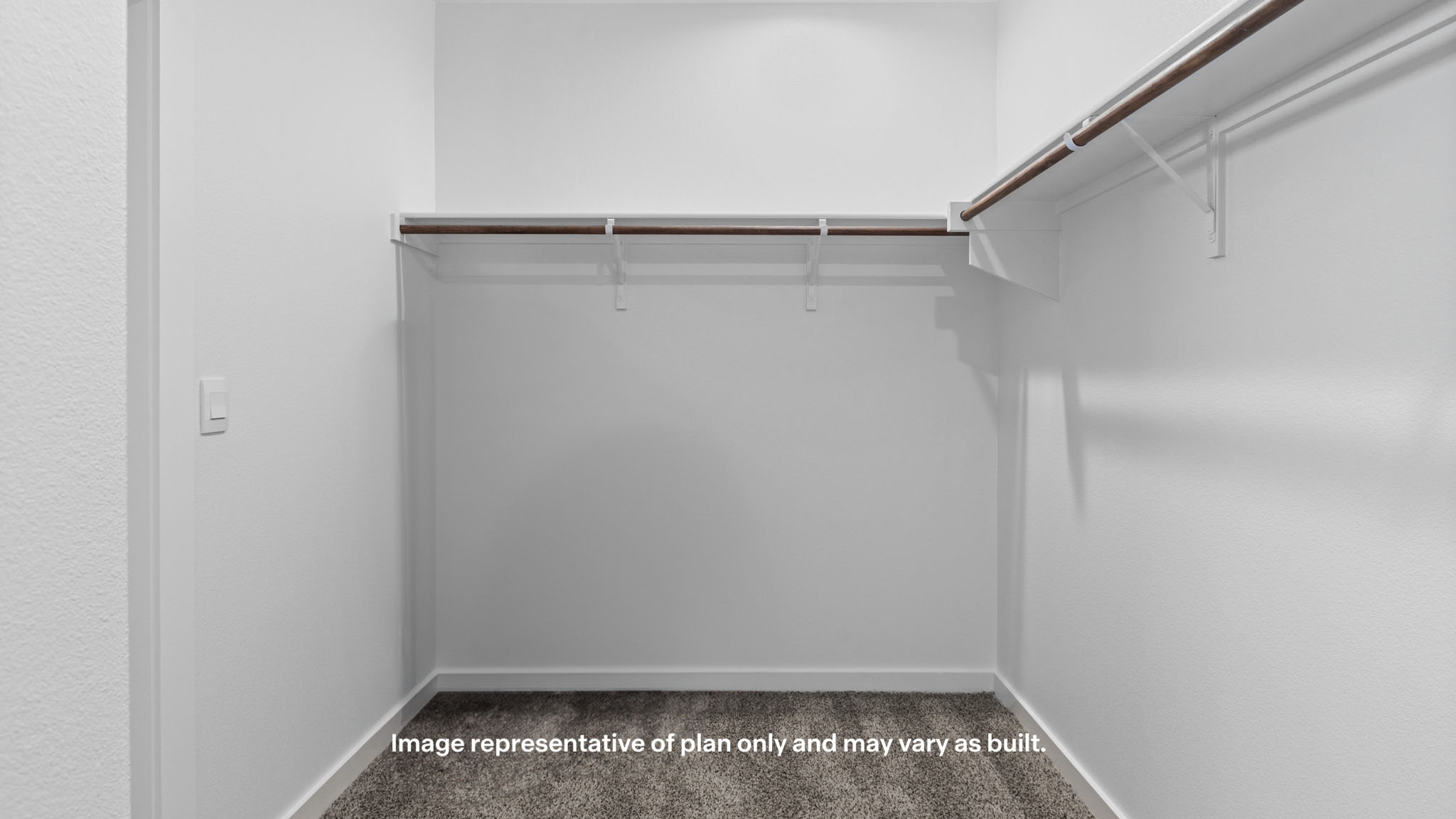 Primary walk-in closet with extra storage space