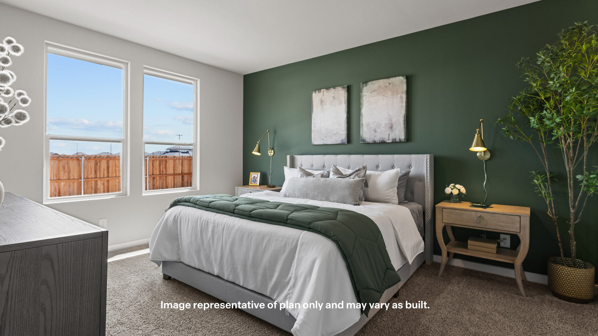 Primary bedroom with plush carpet floors and light allowing double windows
