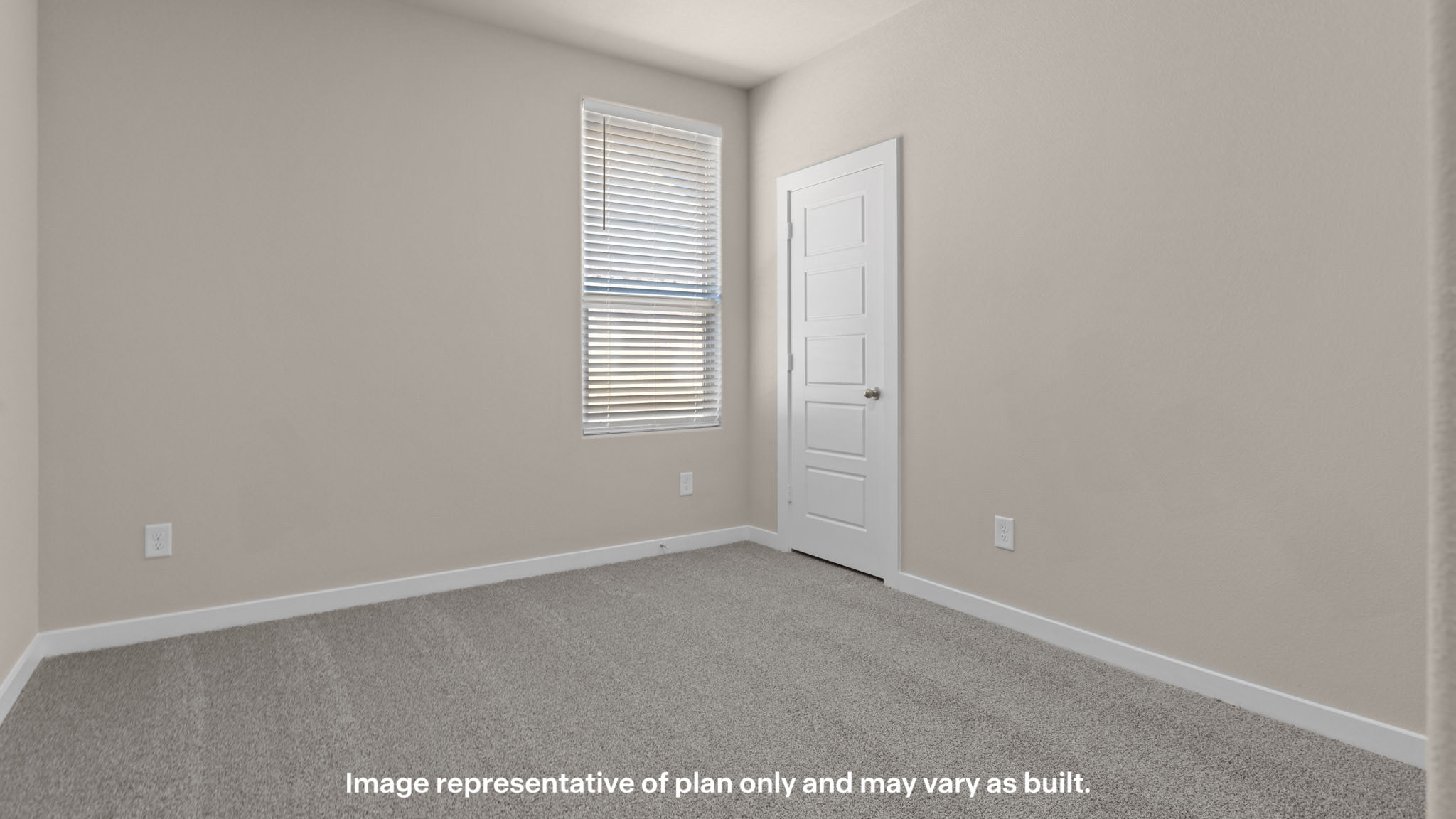Comfortable secondary bedroom with ample floor space, soft carpeting, and a bright window.
