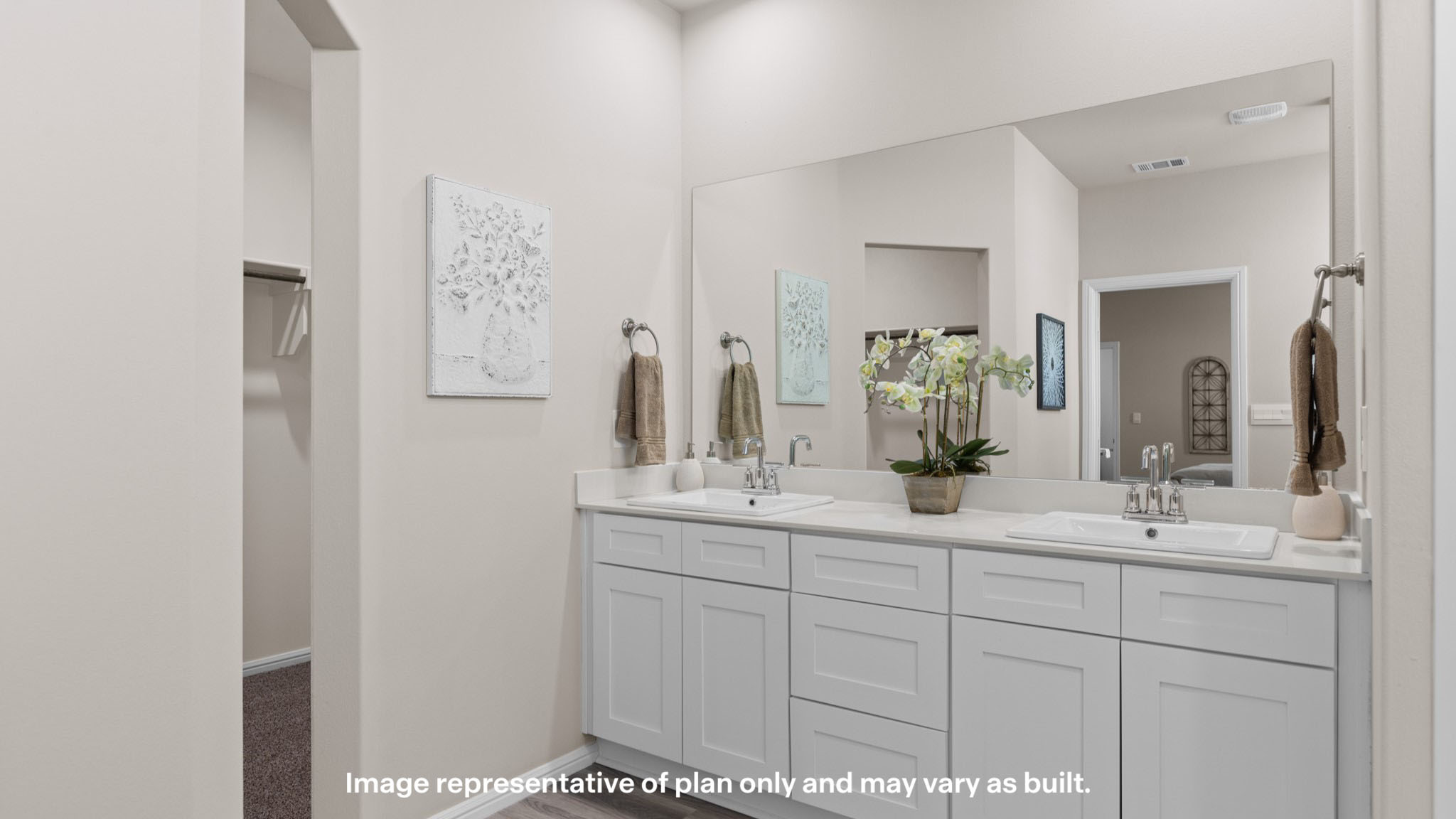 Primary bathroom with built in vanity and luxurious shower