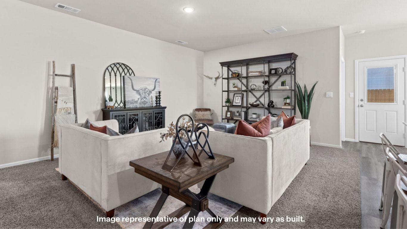 Spacious living room with cozy seating and open layout.