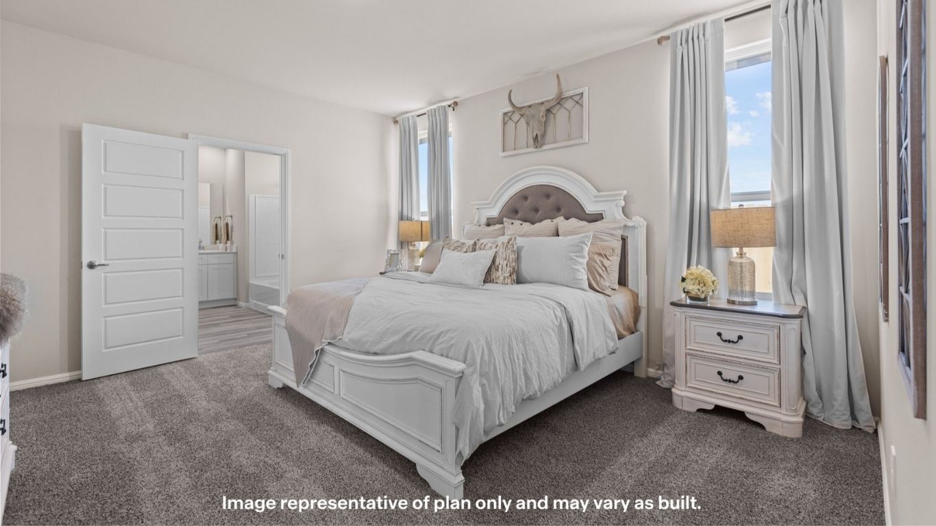 Primary bedroom with plush carpet floors and light allowing double windows