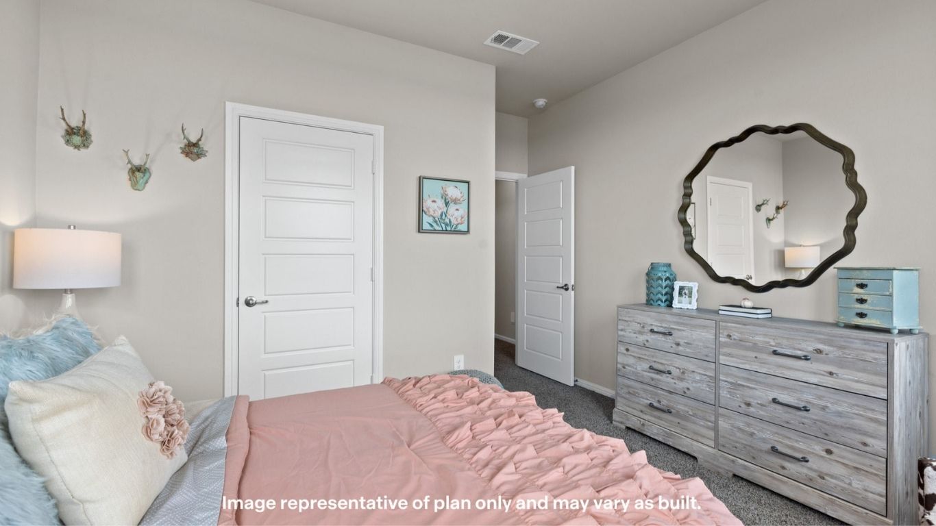 Guest bedroom 1 with front windows and ample natural light