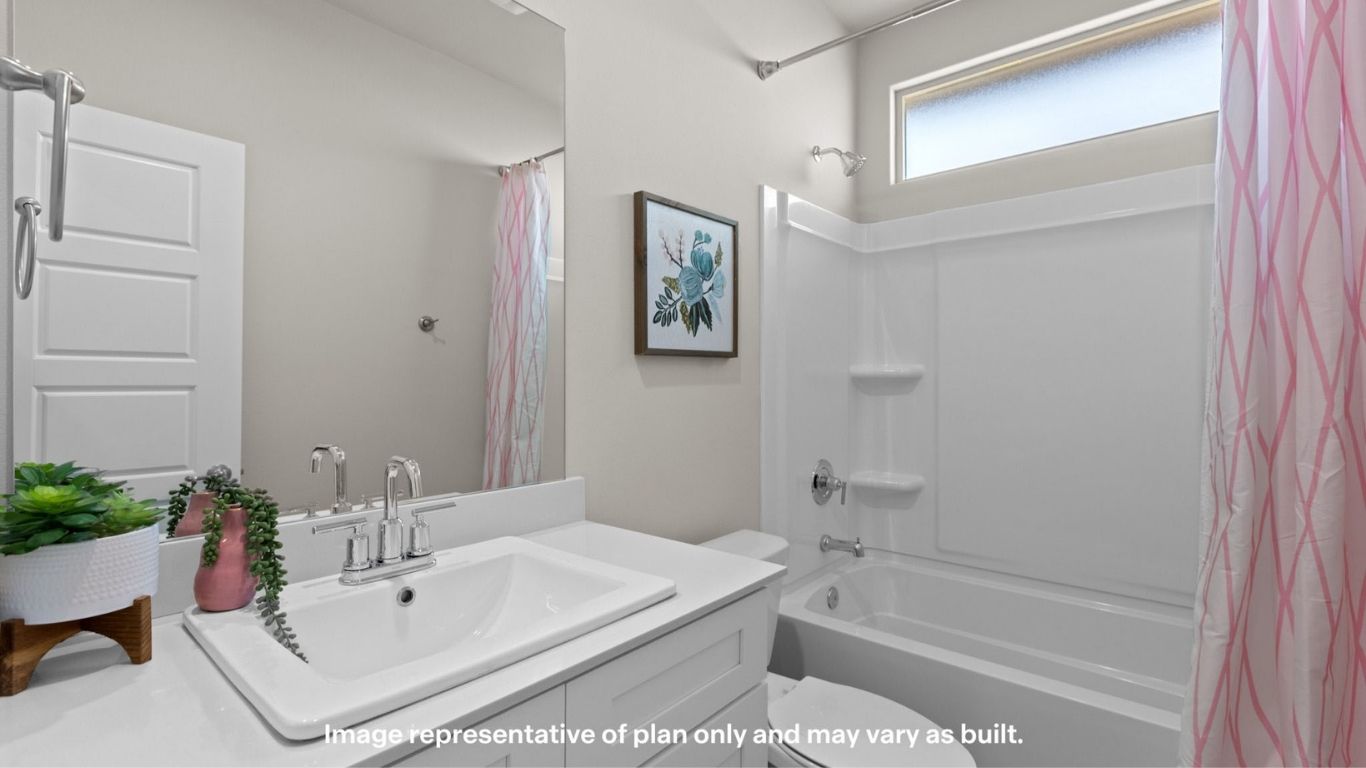Guest bathroom with built in vanity and combination bathtub shower