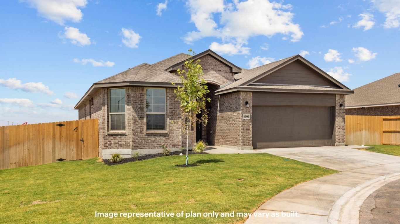 Side view of single story timeless brick home