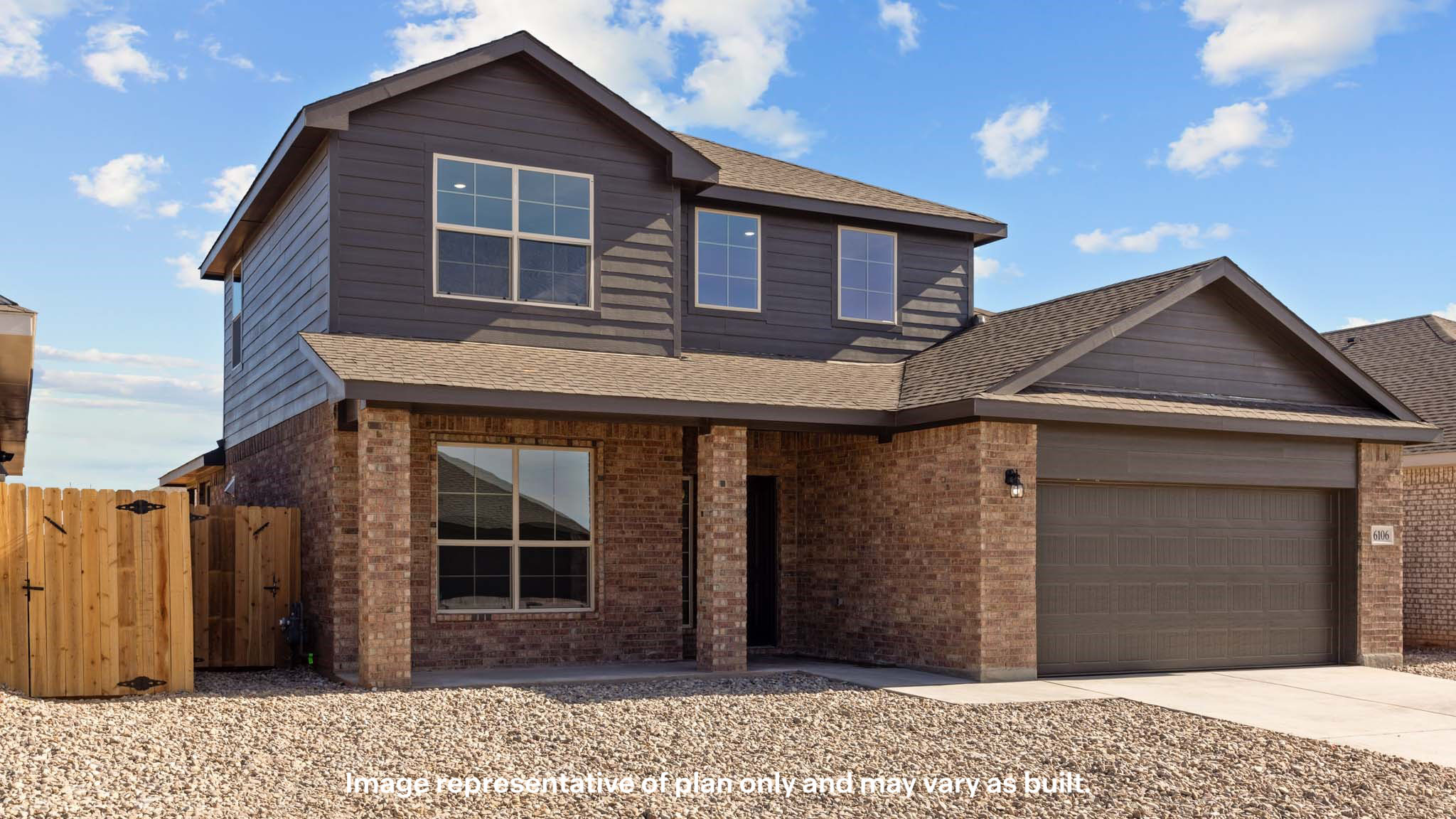 Side view of two story timeless brick home