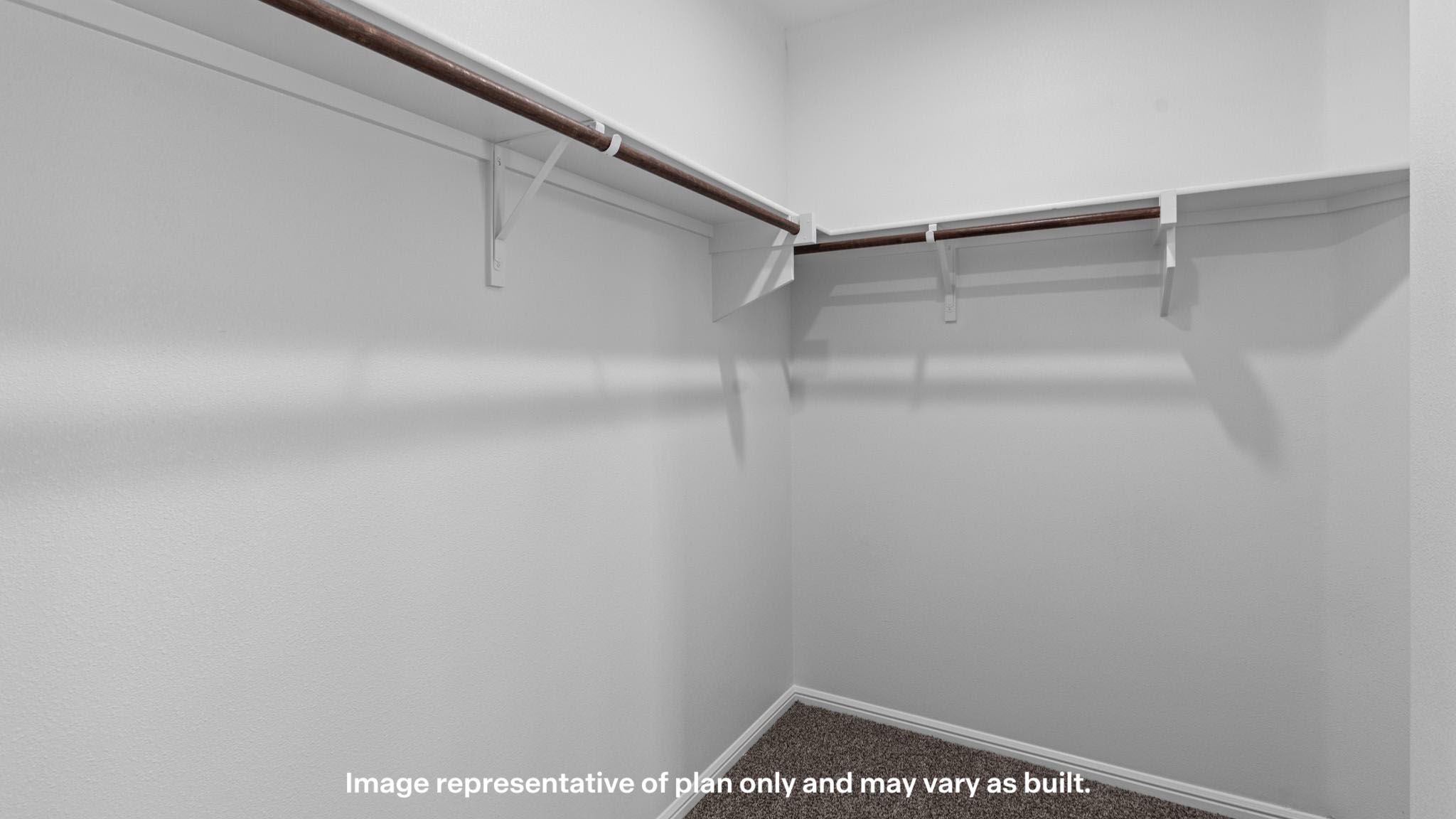 Private primary walk-in closet with extra storage space