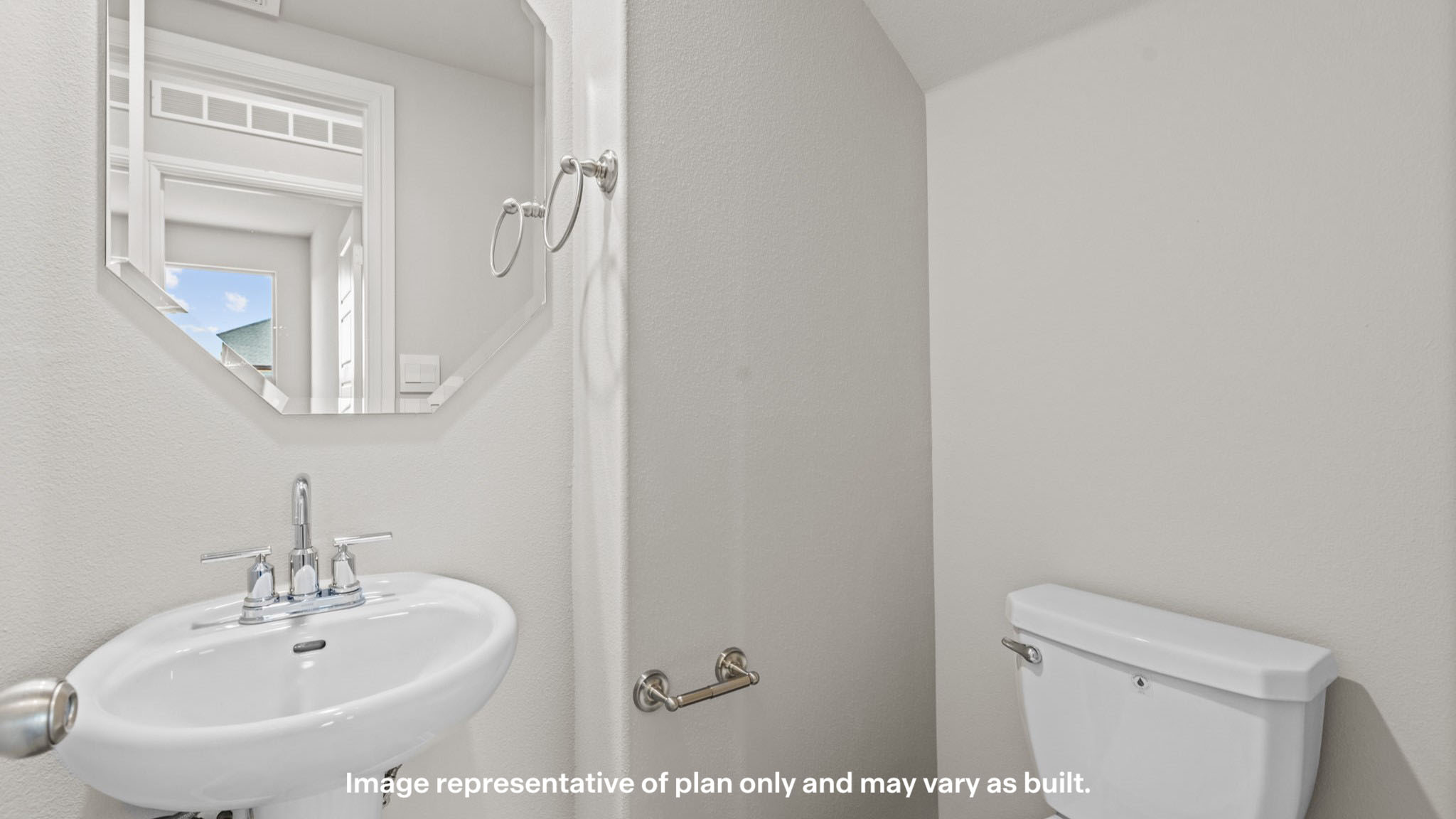 Convenient downstairs powder room with pedestal sink and modern finishes.