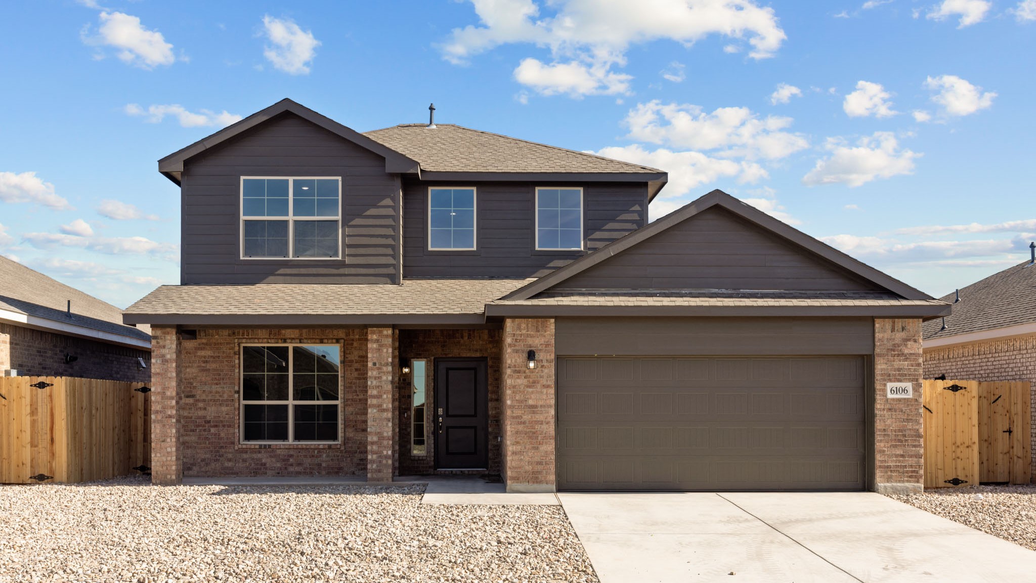 Exterior of two-story single-family timeless brick home