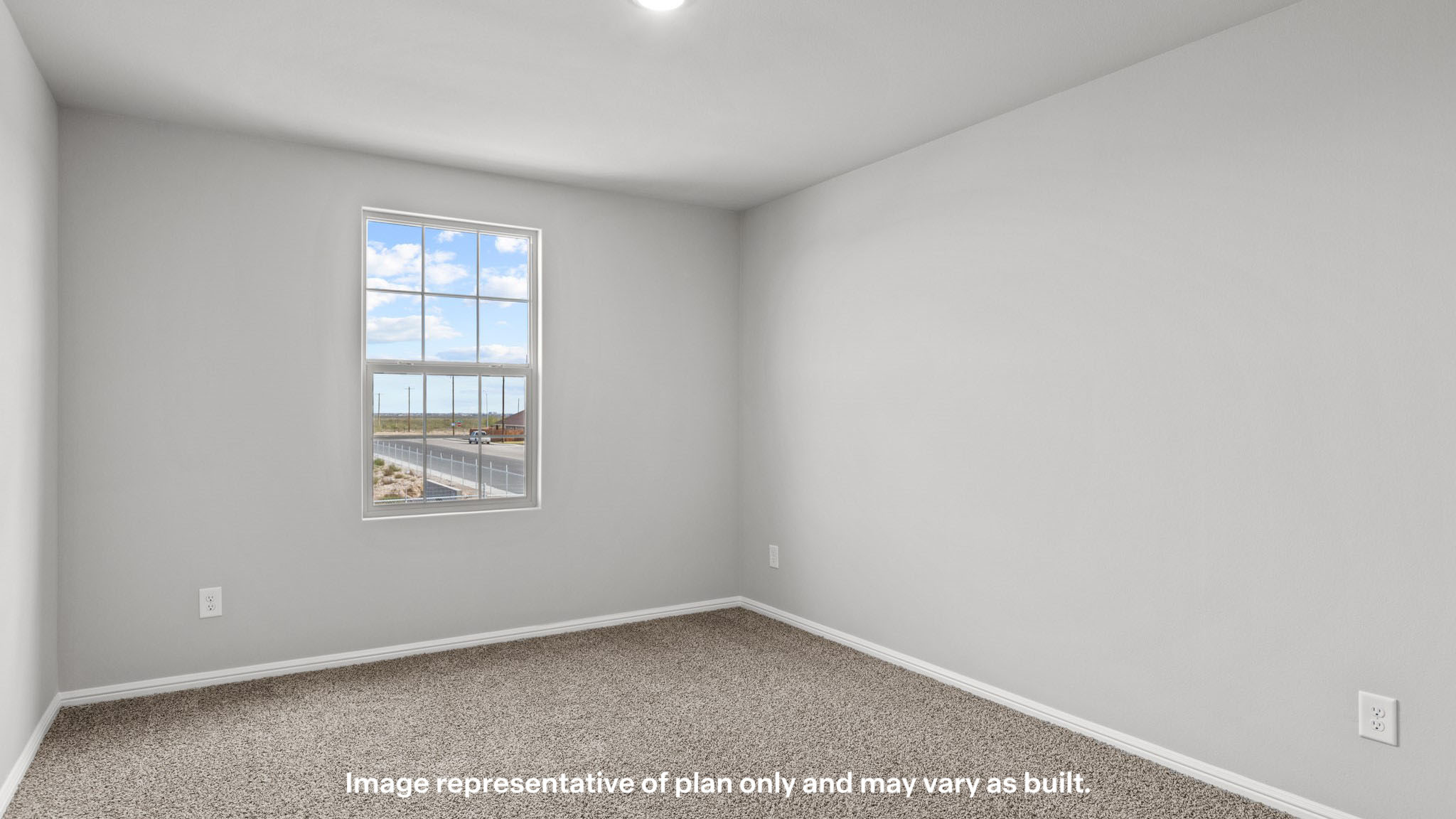 Upstairs guest bedroom 1 with plush carpet floors