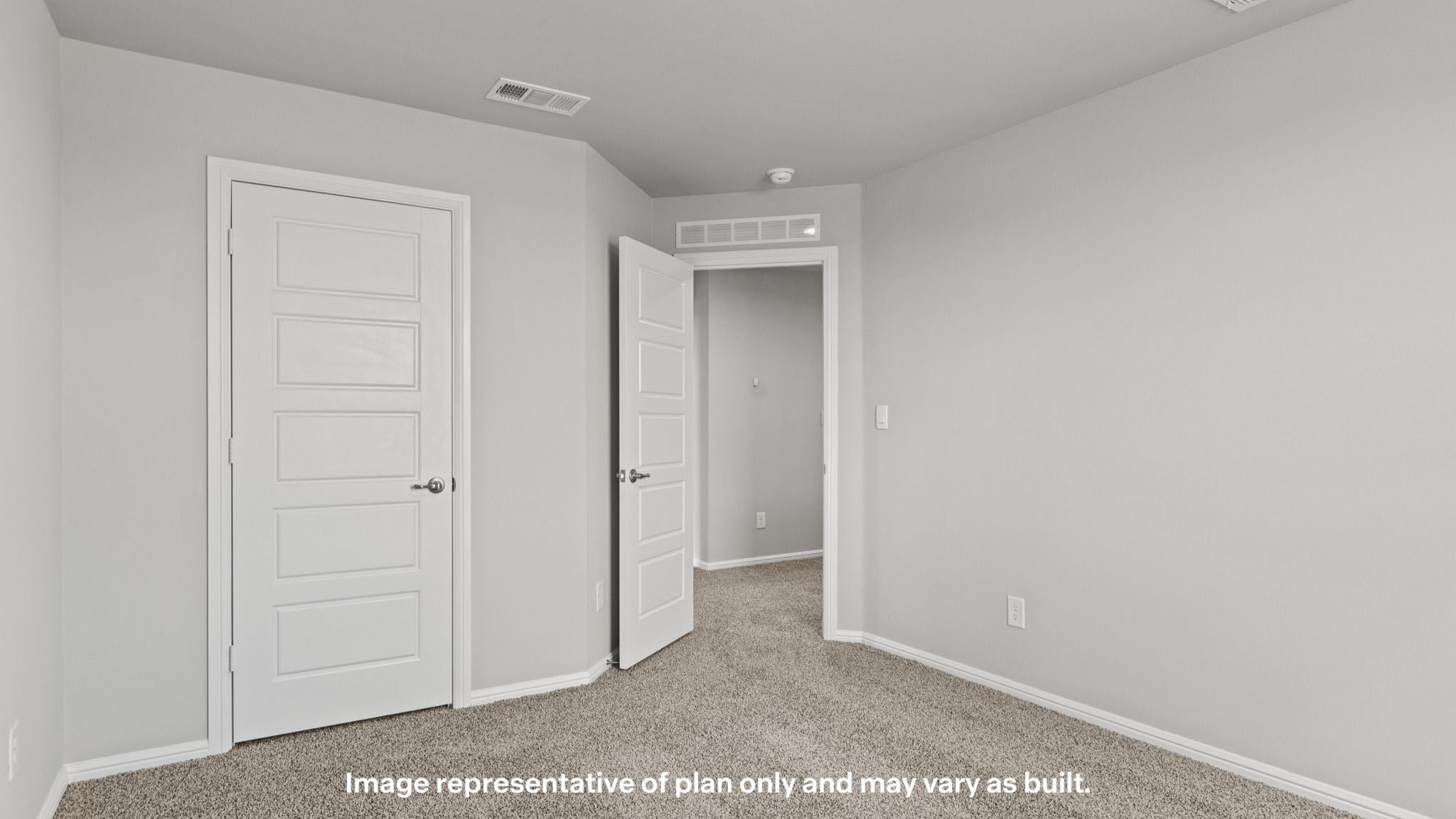 Upstairs guest bedroom 1 with plush carpet floors