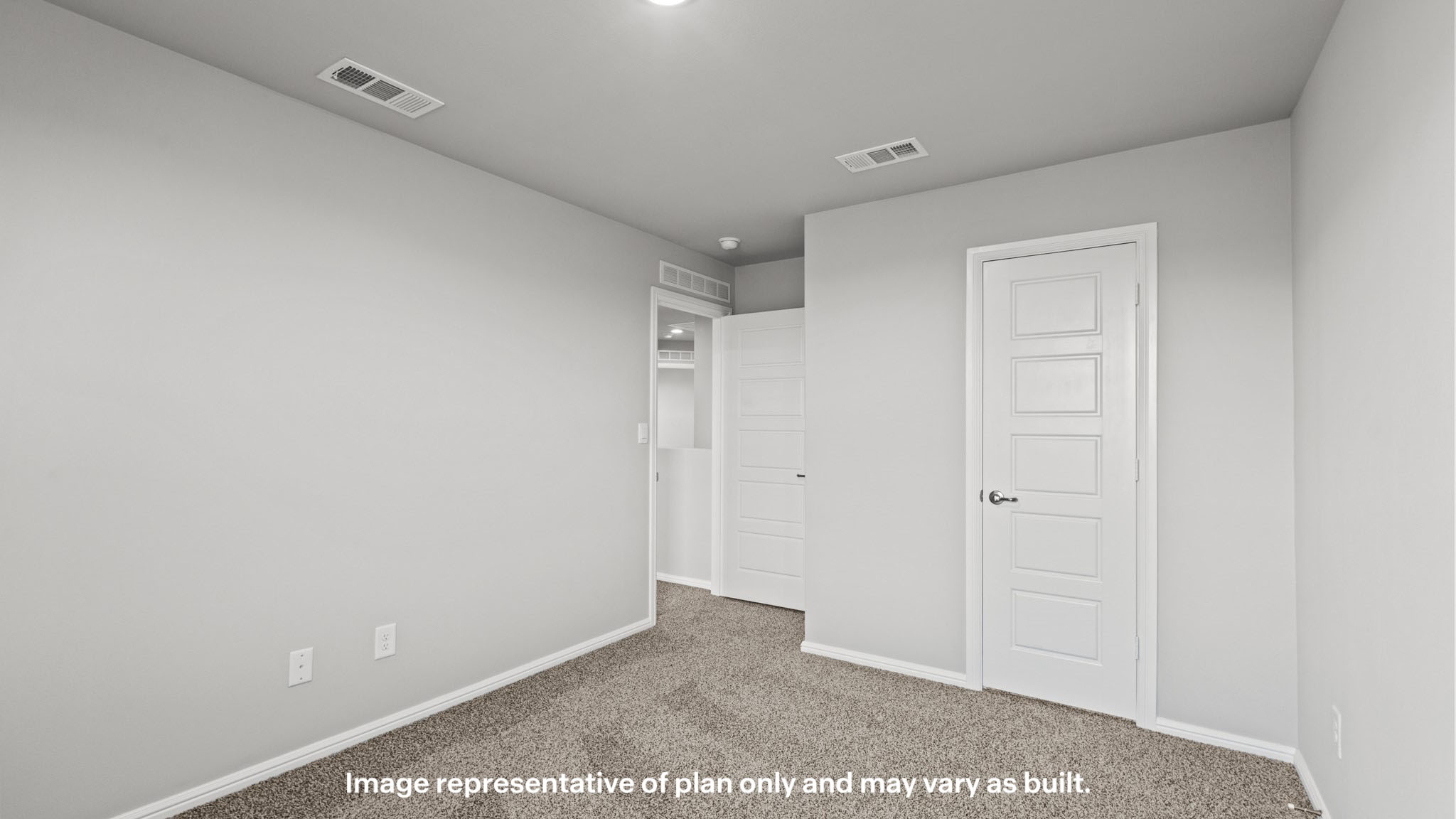 Upstairs guest bedroom 1 with plush carpet floors