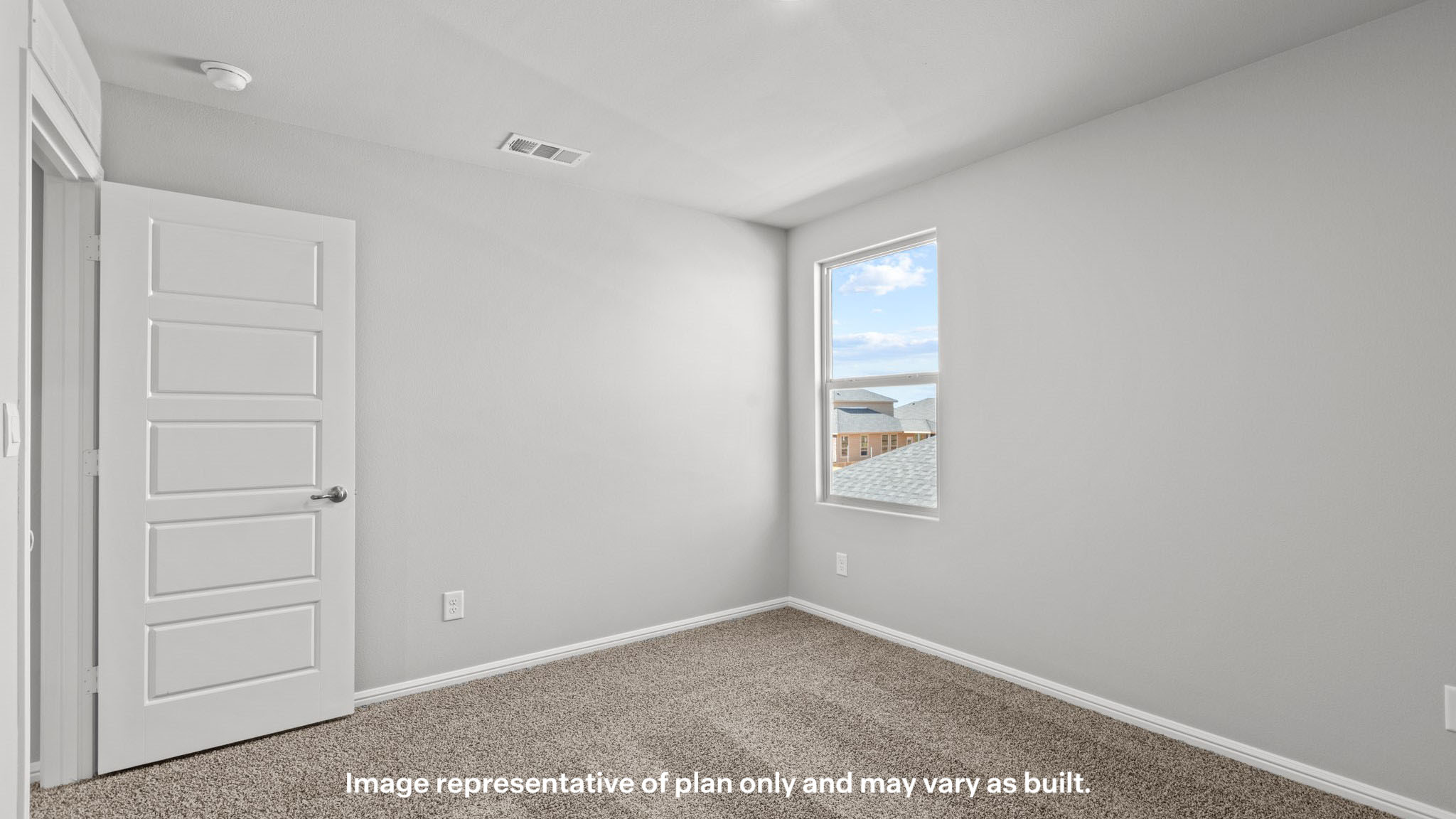 Upstairs guest bedroom 1 with plush carpet floors