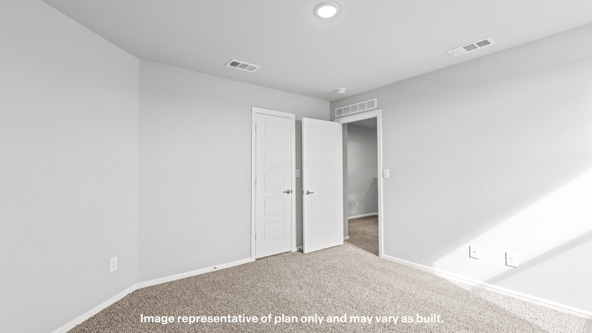 Upstairs guest bedroom 1 with plush carpet floors