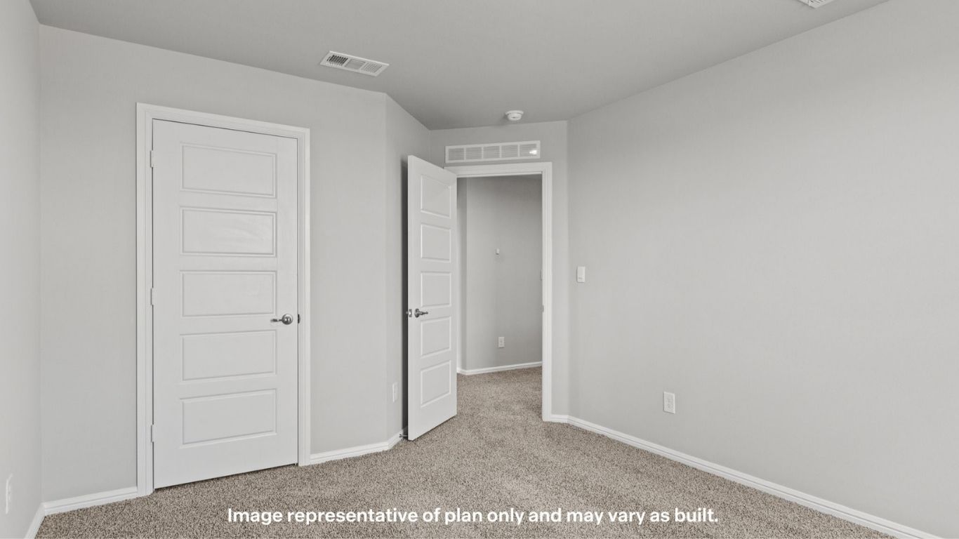 Upstairs guest bedroom 1 with plush carpet floors